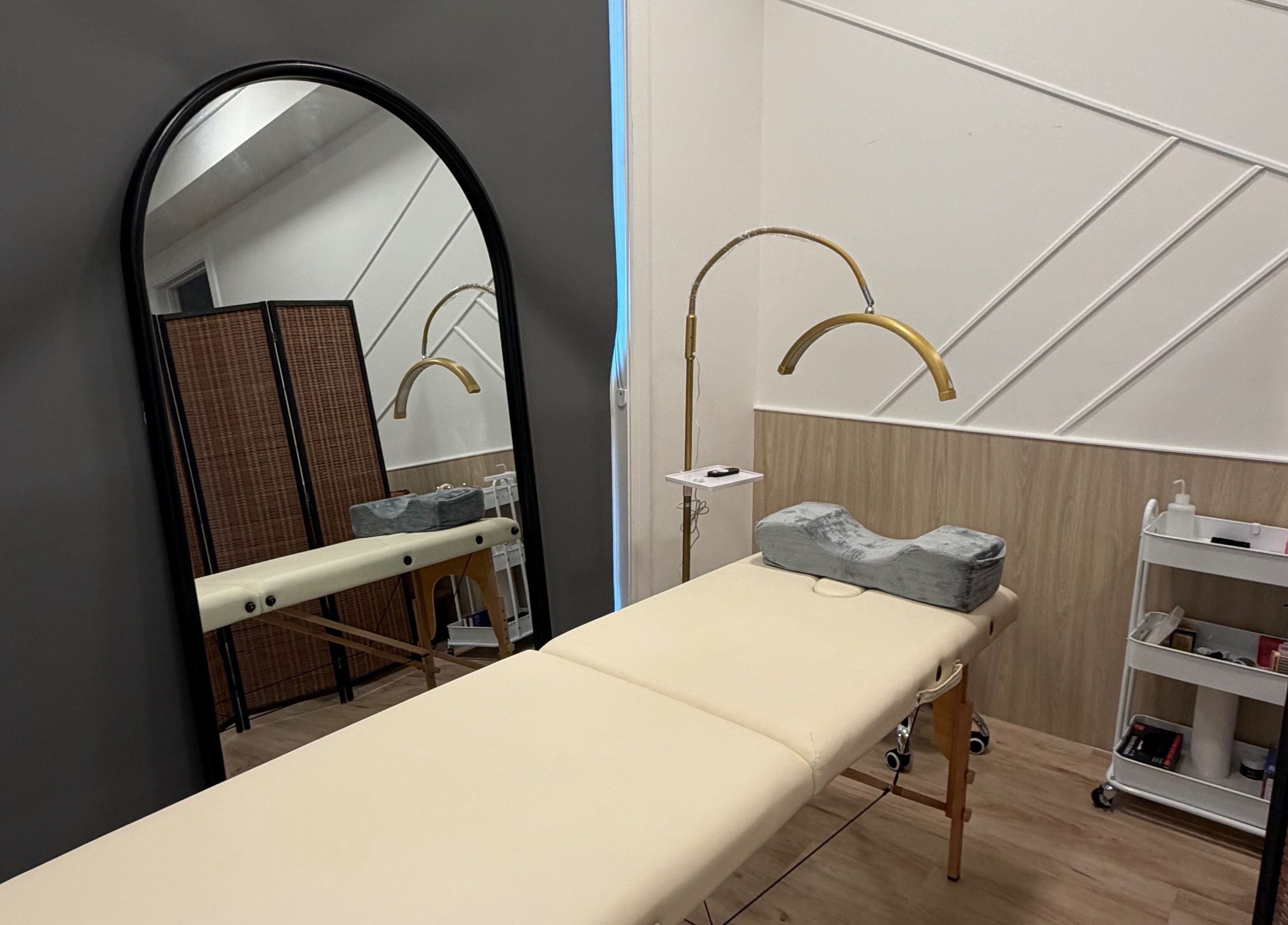 LASH VIBES beauty room with treatment bed and modern decor in Calgary, Alberta, CA.