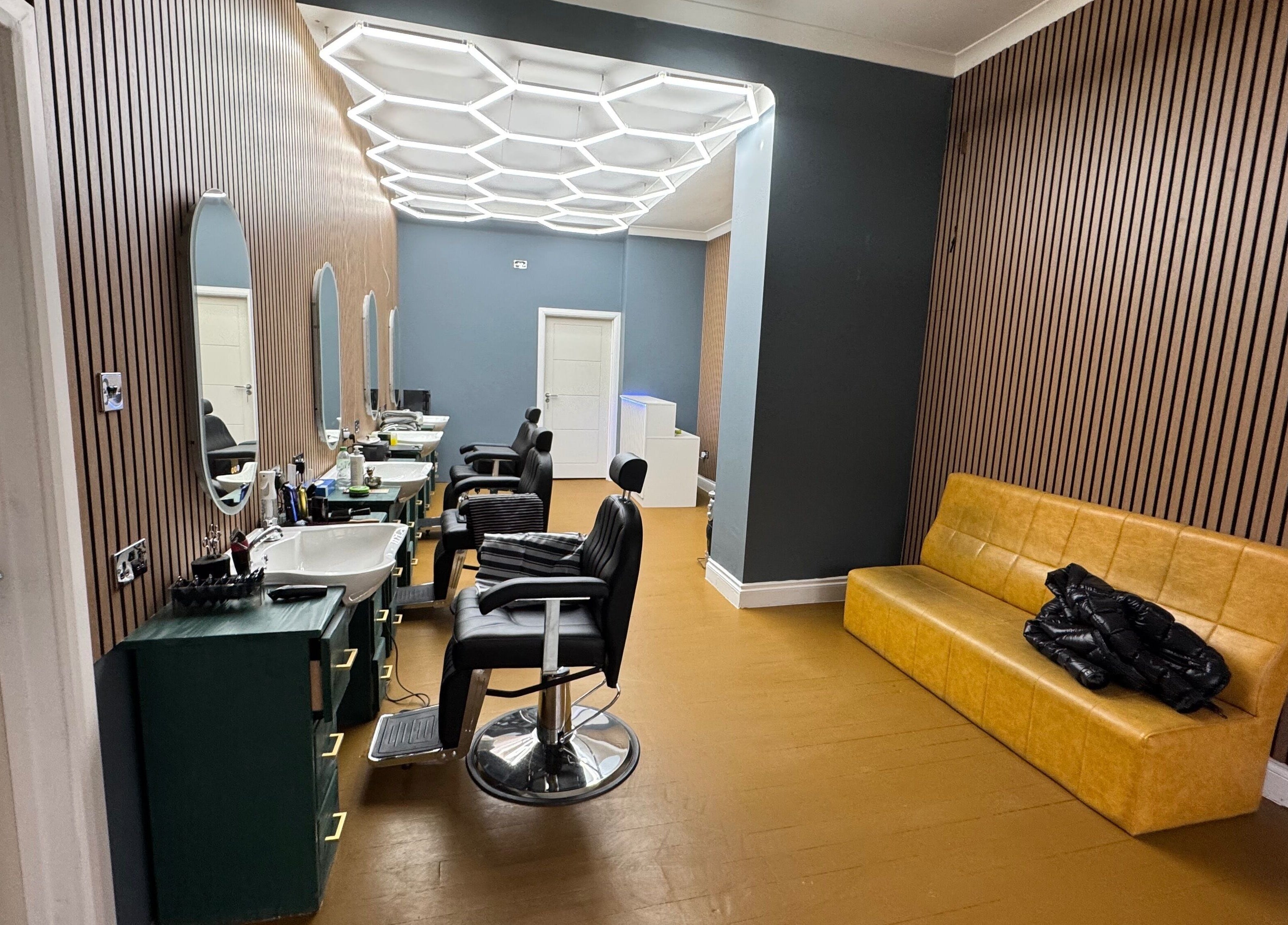 Modern barber chairs and decor at STEEL BARBERS, London, England, GB.