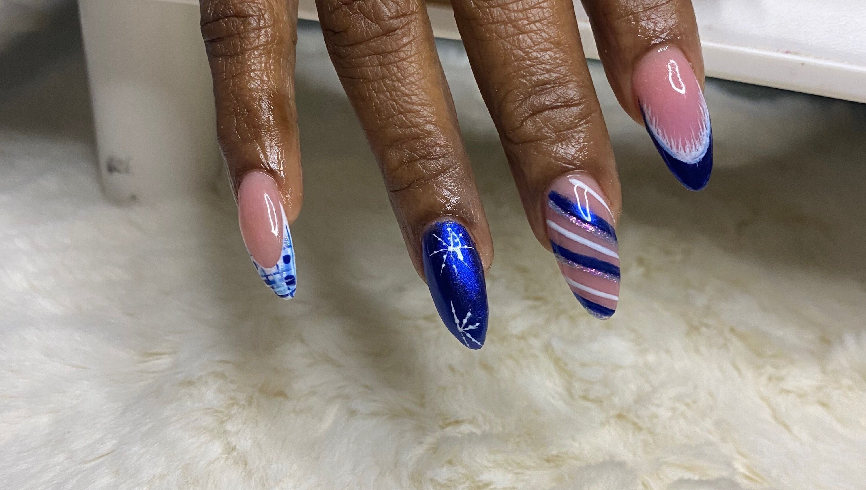 Elegant blue and pink nail art at Red Cutex, Saint George, Saint George, BB, showcasing intricate designs.