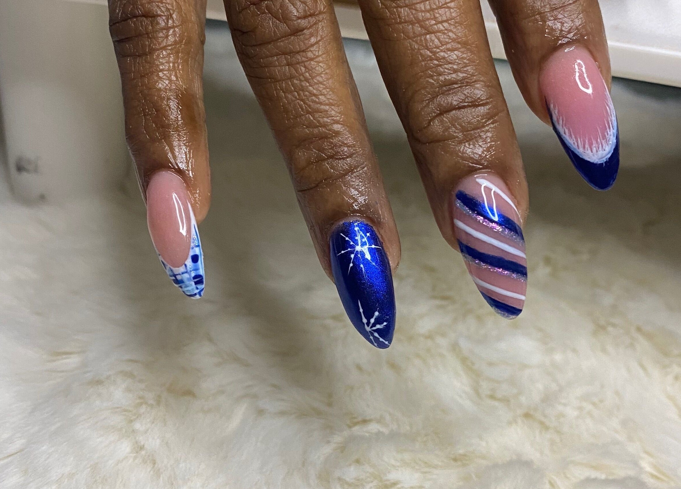 Elegant blue and pink nail art at Red Cutex, Saint George, Saint George, BB, showcasing intricate designs.