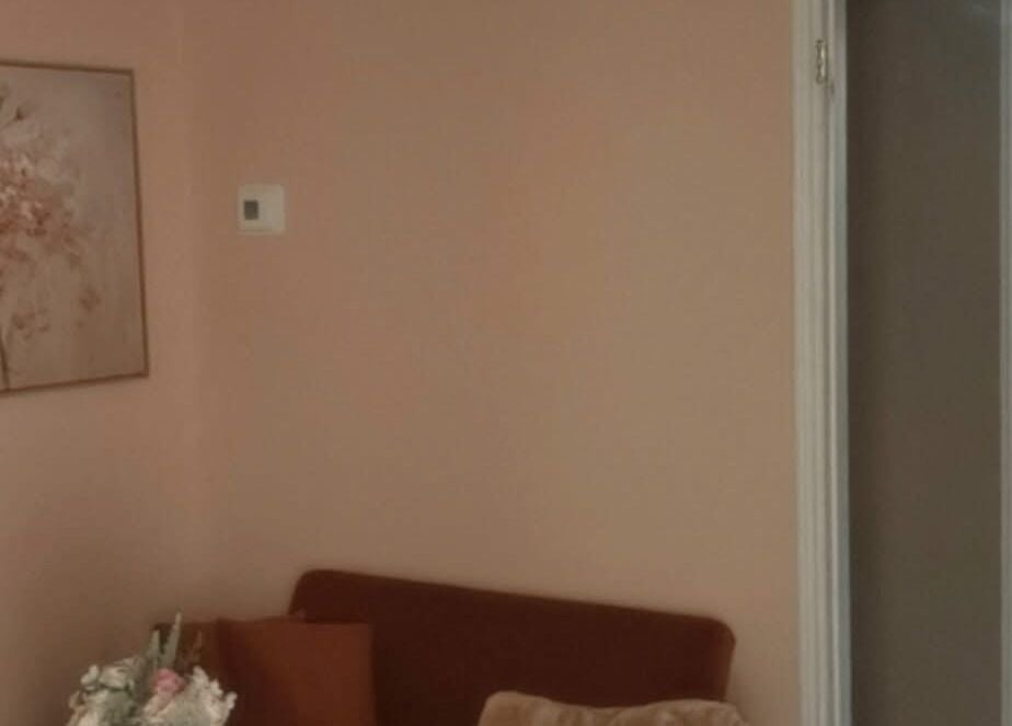 Cozy seating area with floral art at Dyosa Beauty and Wellness Lounge, Hamilton, Ontario, CA.