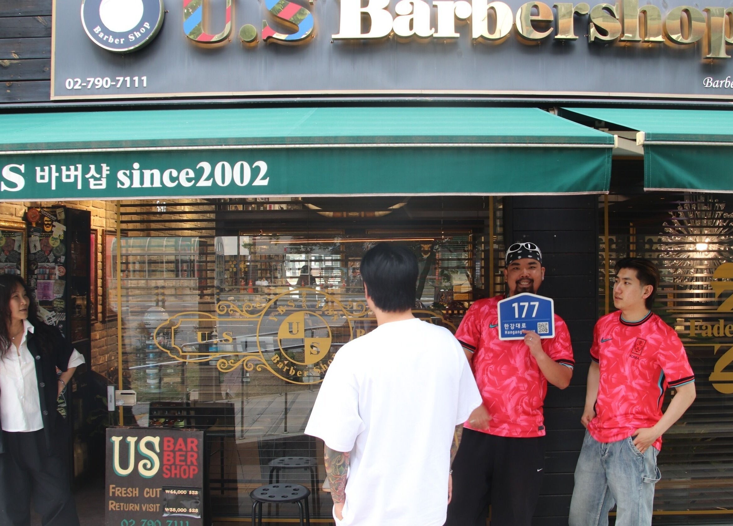 US Barbershop Seoul exterior with staff and customers, located at 서울특별시, 서울특별시, KR.