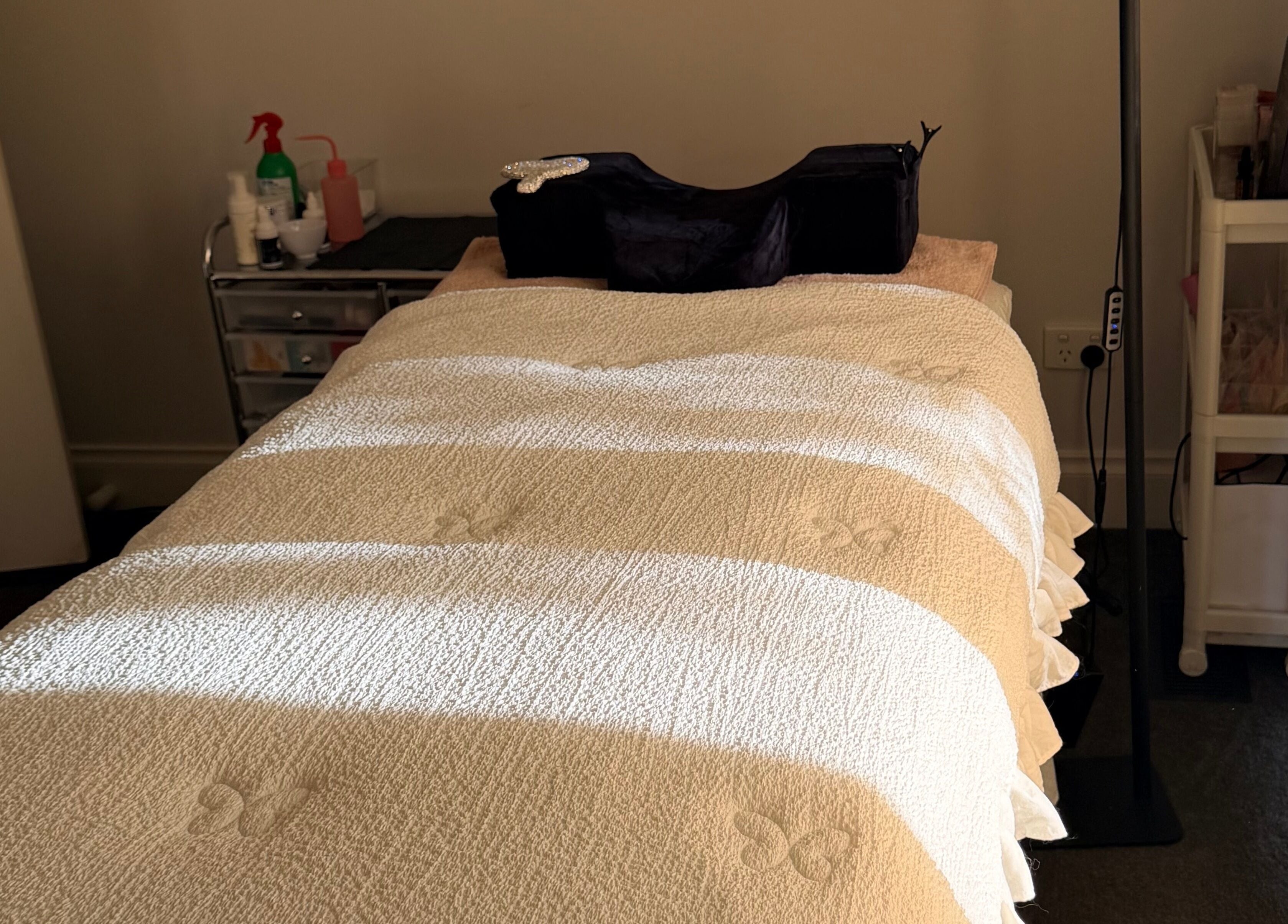 Massage bed at Beauchi & Co, Melbourne, Victoria, AU, bathed in warm sunlight for ultimate relaxation.