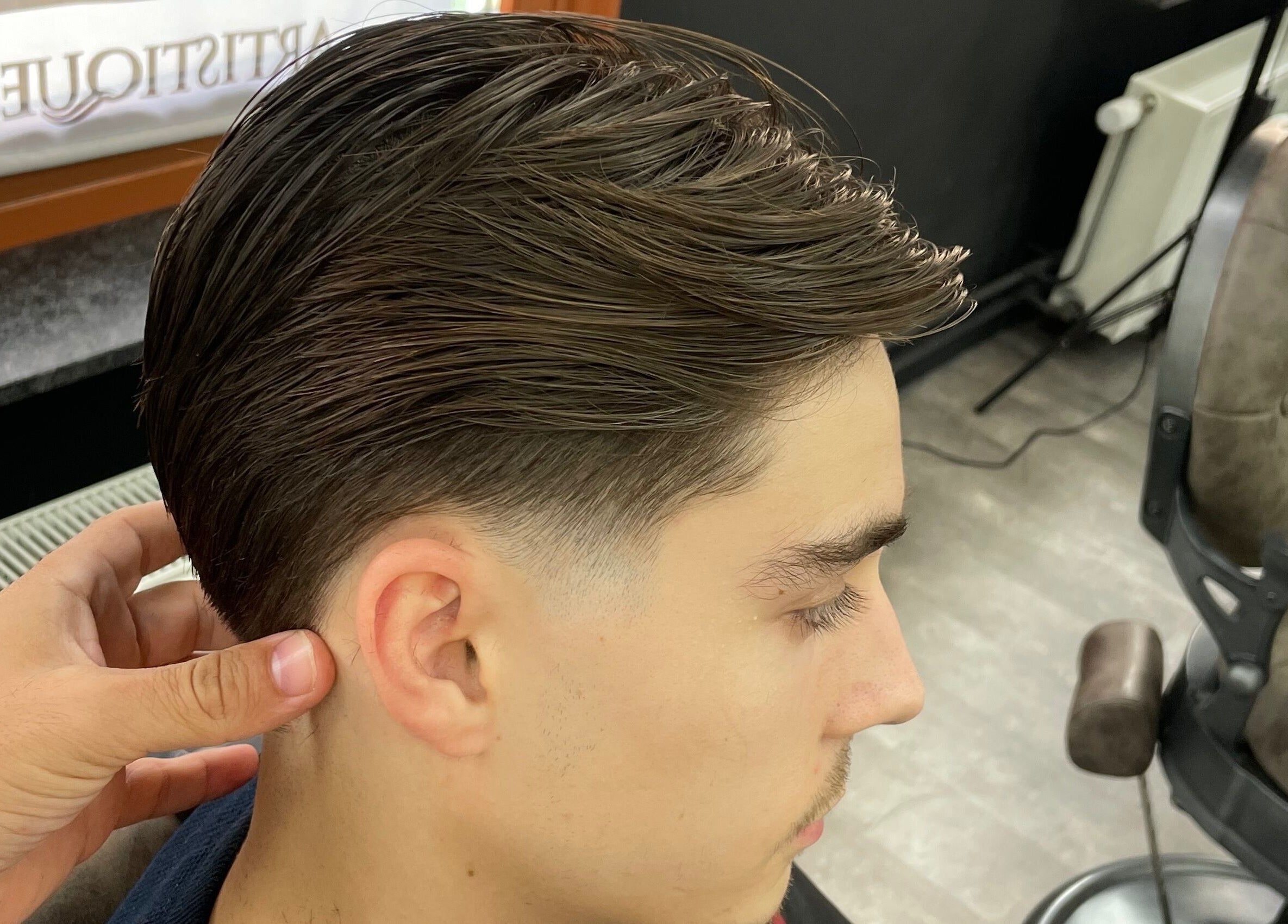 Close-up of a stylish haircut at Fade Culture Barbershop, Mosta, MT, showcasing expert grooming.