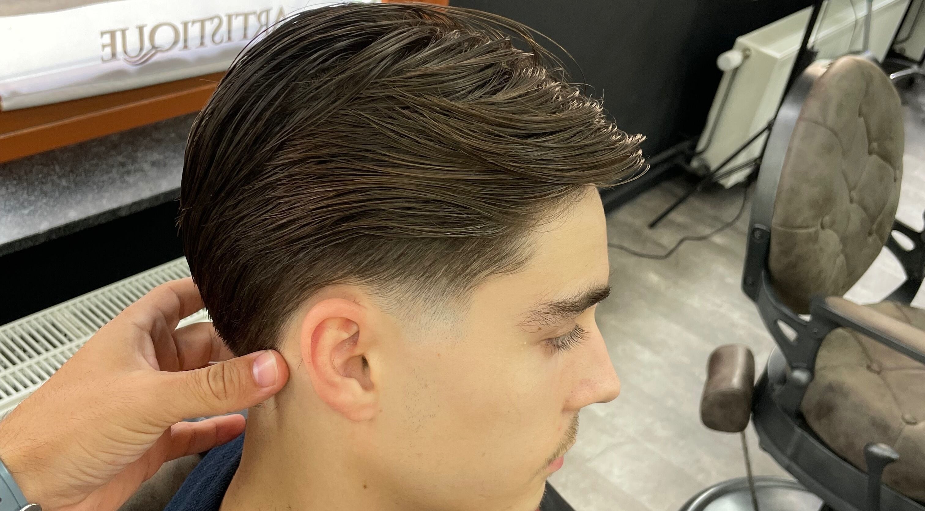 A stylish haircut at Fade Culture Barbershop in Mosta, MT, showcasing expert barbering techniques.