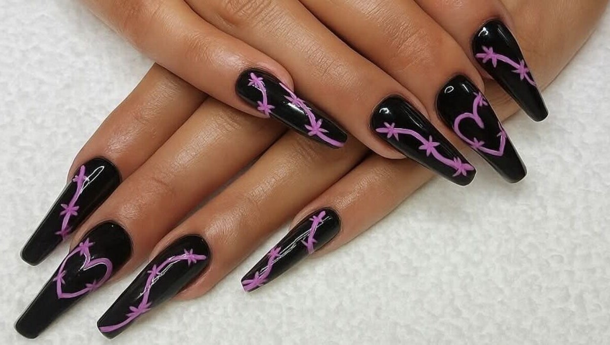 Chic black nails with purple designs from THE CUTICLE CONNECTION NEW, Alberton, Gauteng, ZA.