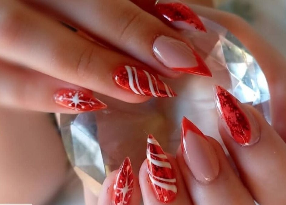Stunning red nail artistry at THE CUTICLE CONNECTION NEW, Alberton, Gauteng, ZA, showcasing intricate designs.