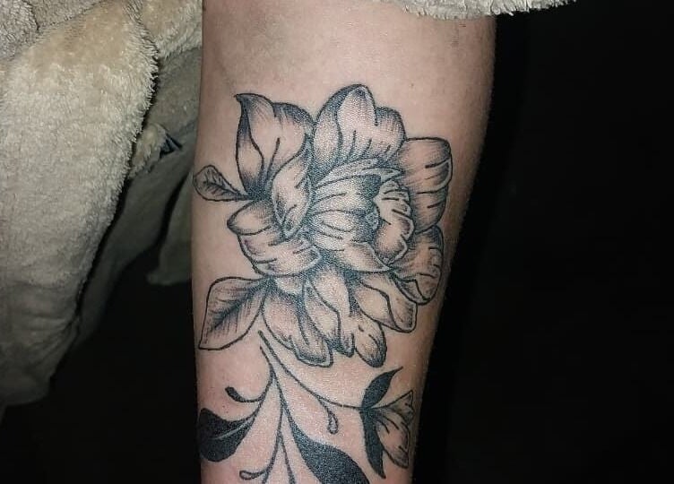 Floral tattoo design by Tattoo with Khalifa Inc. in George, Western Cape, ZA highlights intricate artistry.