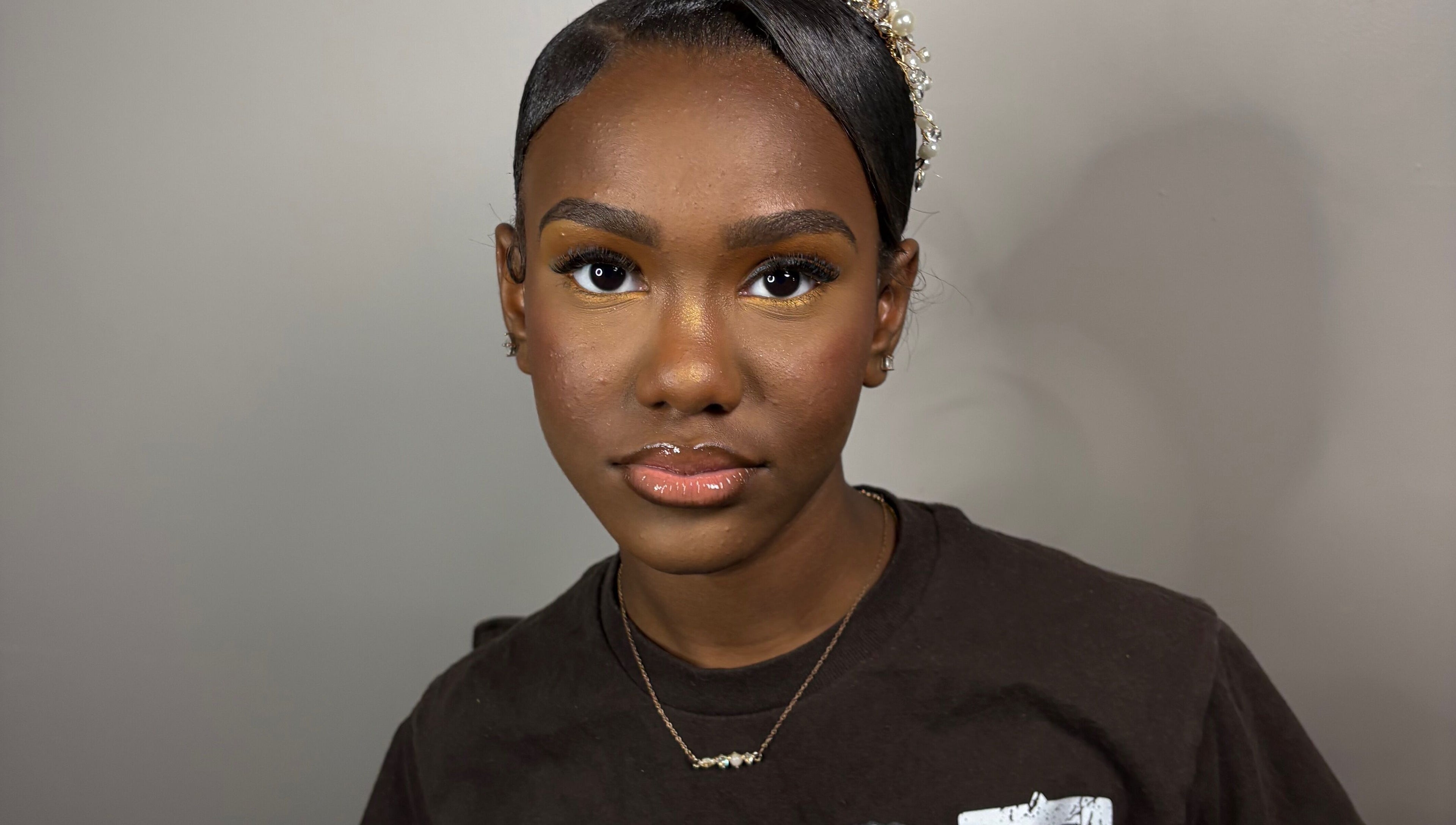 A client with elegant makeup and hairstyle at KymLee Beauty, Oak Park, Michigan, US.