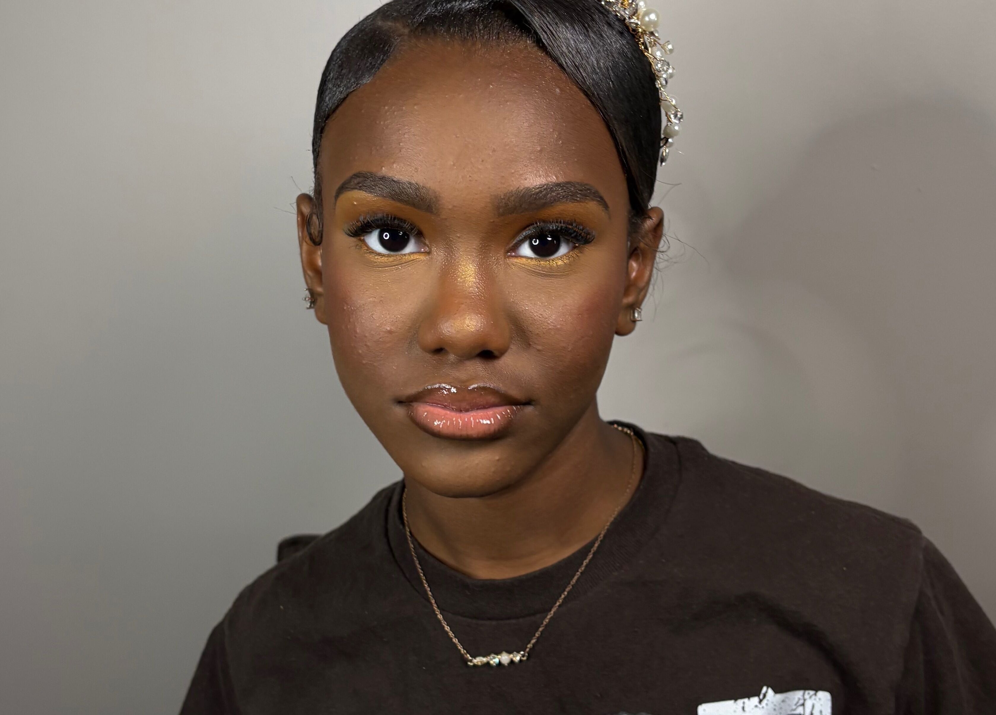 A client with elegant makeup and hairstyle at KymLee Beauty, Oak Park, Michigan, US.