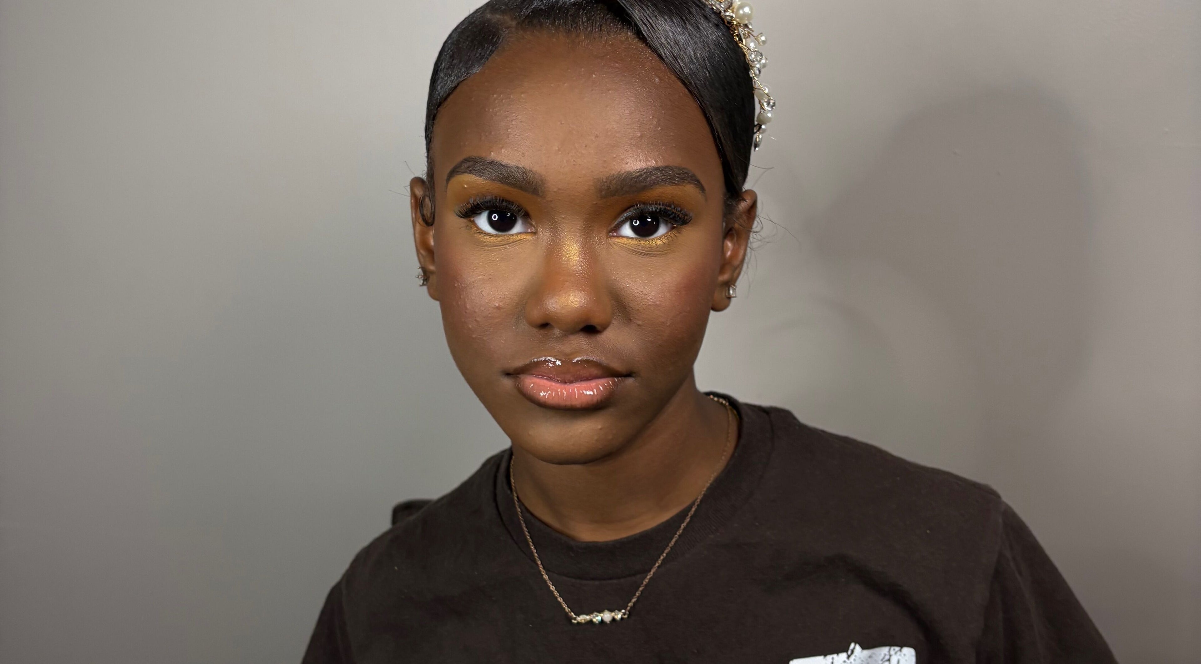 A client with elegant makeup and hairstyle at KymLee Beauty, Oak Park, Michigan, US.