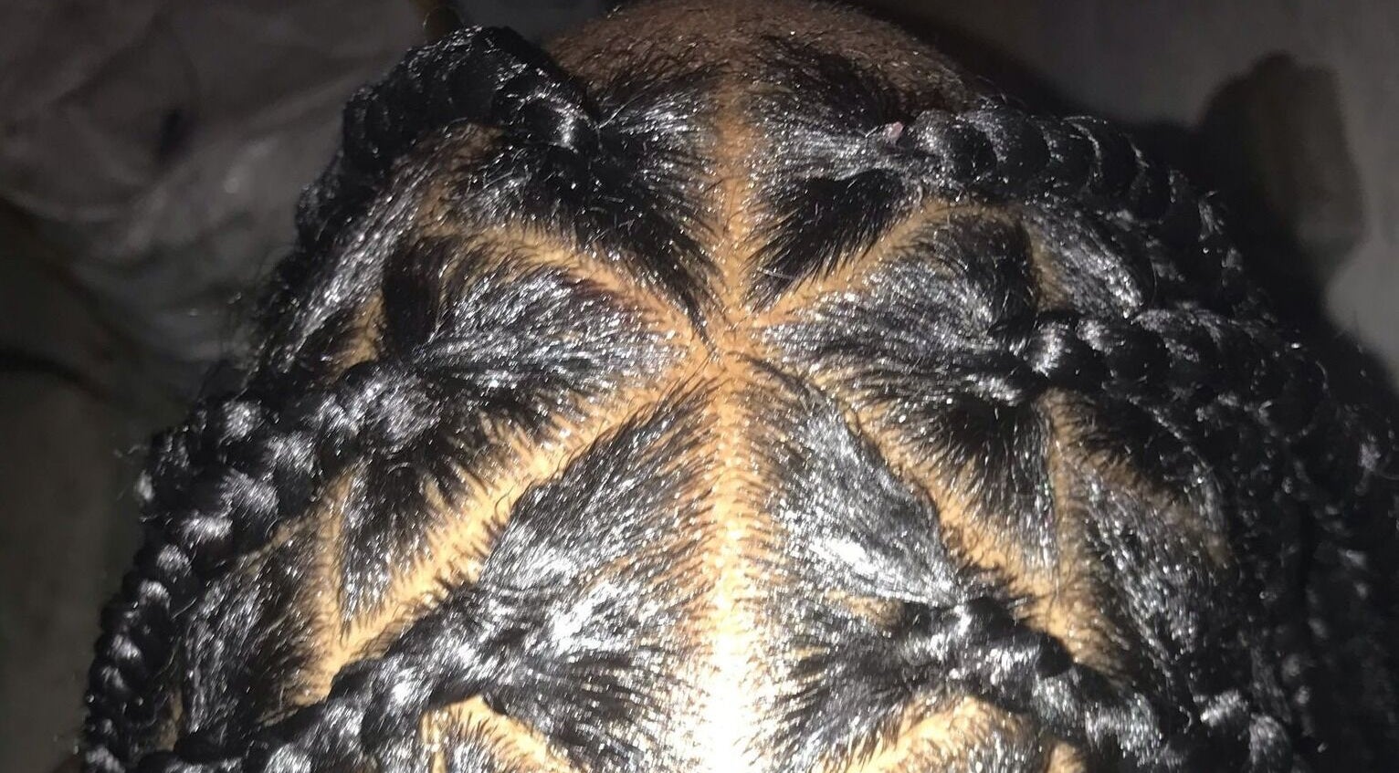 Close-up of intricate braided hairstyle at The Naï Effect, Saint Thomas, Saint Thomas, BB.