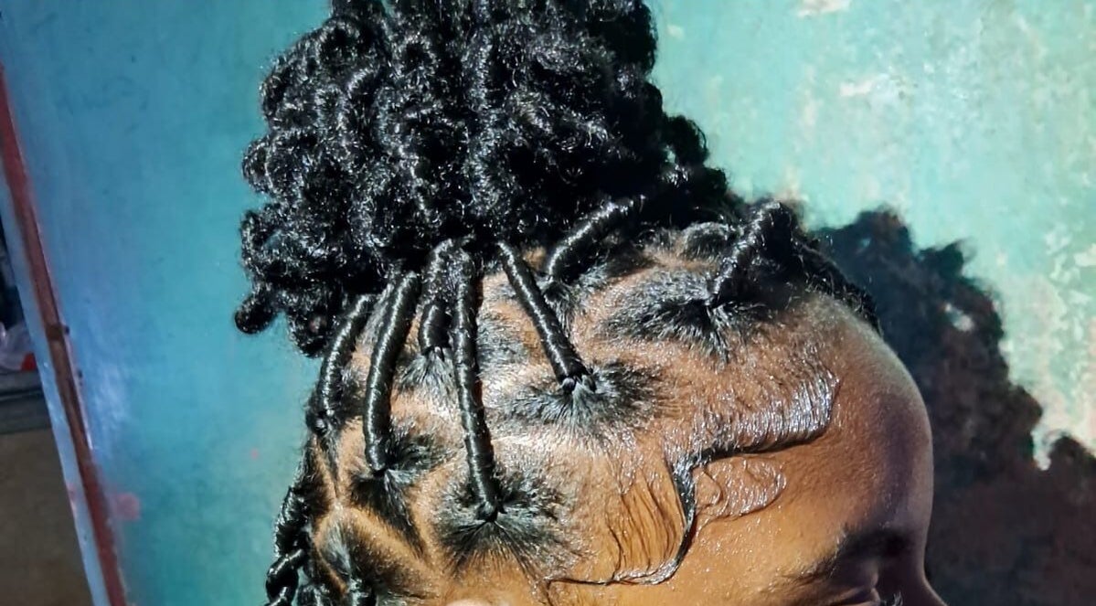 Intricate braided hairstyle at The Naï Effect, Saint Thomas, Saint Thomas, BB, showcasing creative styling.