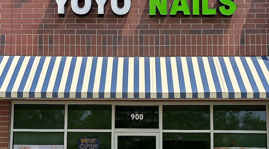 YOYO NAILS storefront with striped awning in Noblesville, Indiana, US.