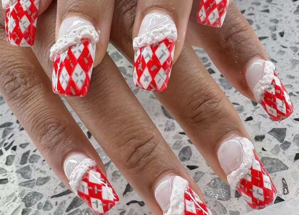Red and white festive nail design at YOYO NAILS in Noblesville, Indiana, US.