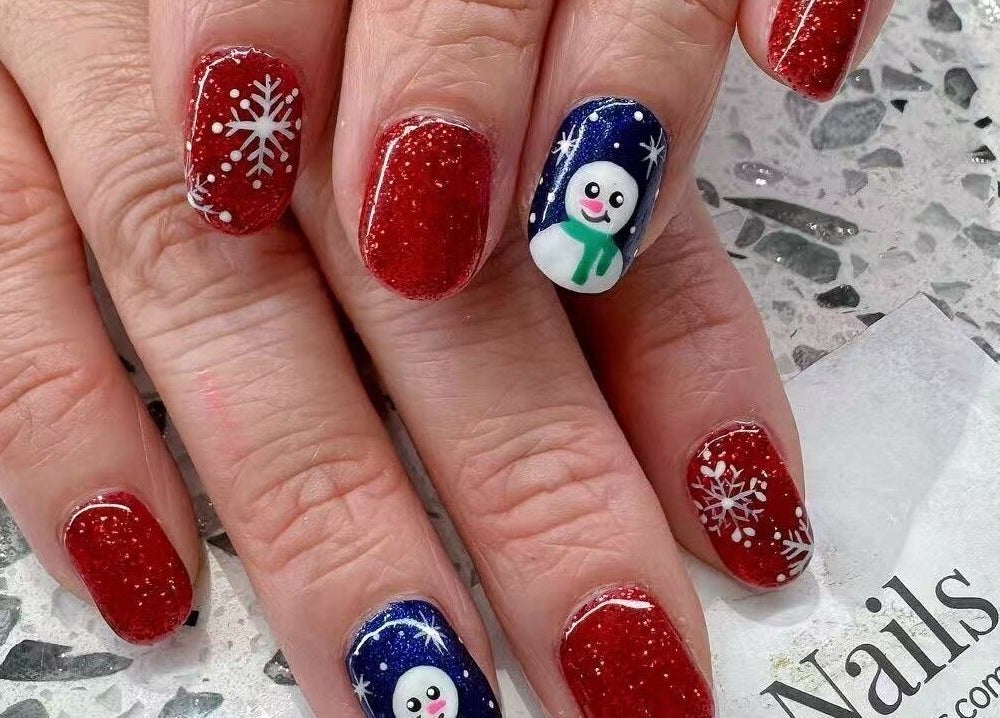 YOYO NAILS holiday nail art with snowflakes and snowman in Noblesville, Indiana, US.