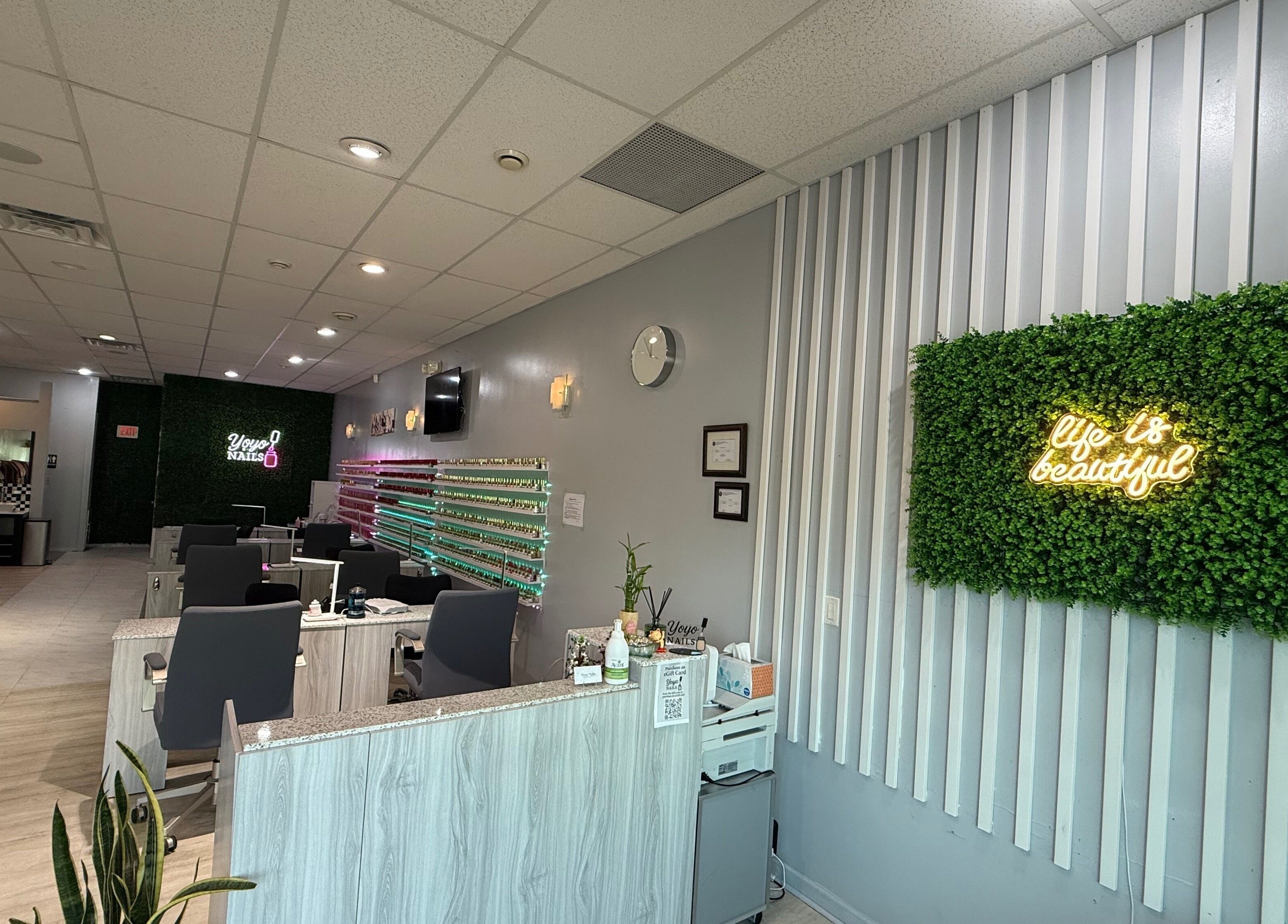 Interior of Yoyo Nails in Noblesville, Indiana, US with chic decor and nail stations.