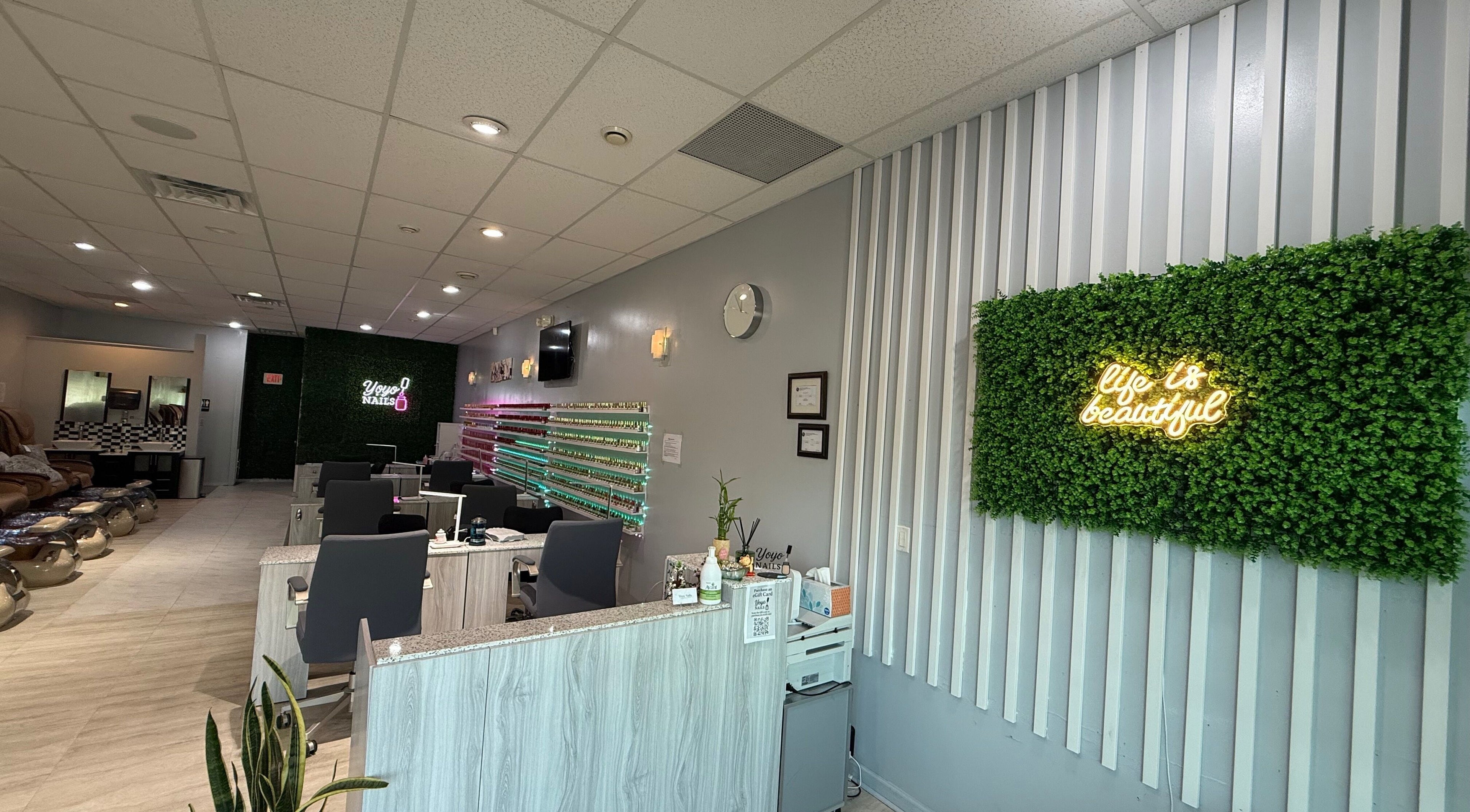 Interior of Yoyo Nails in Noblesville, Indiana, US with chic decor and nail stations.