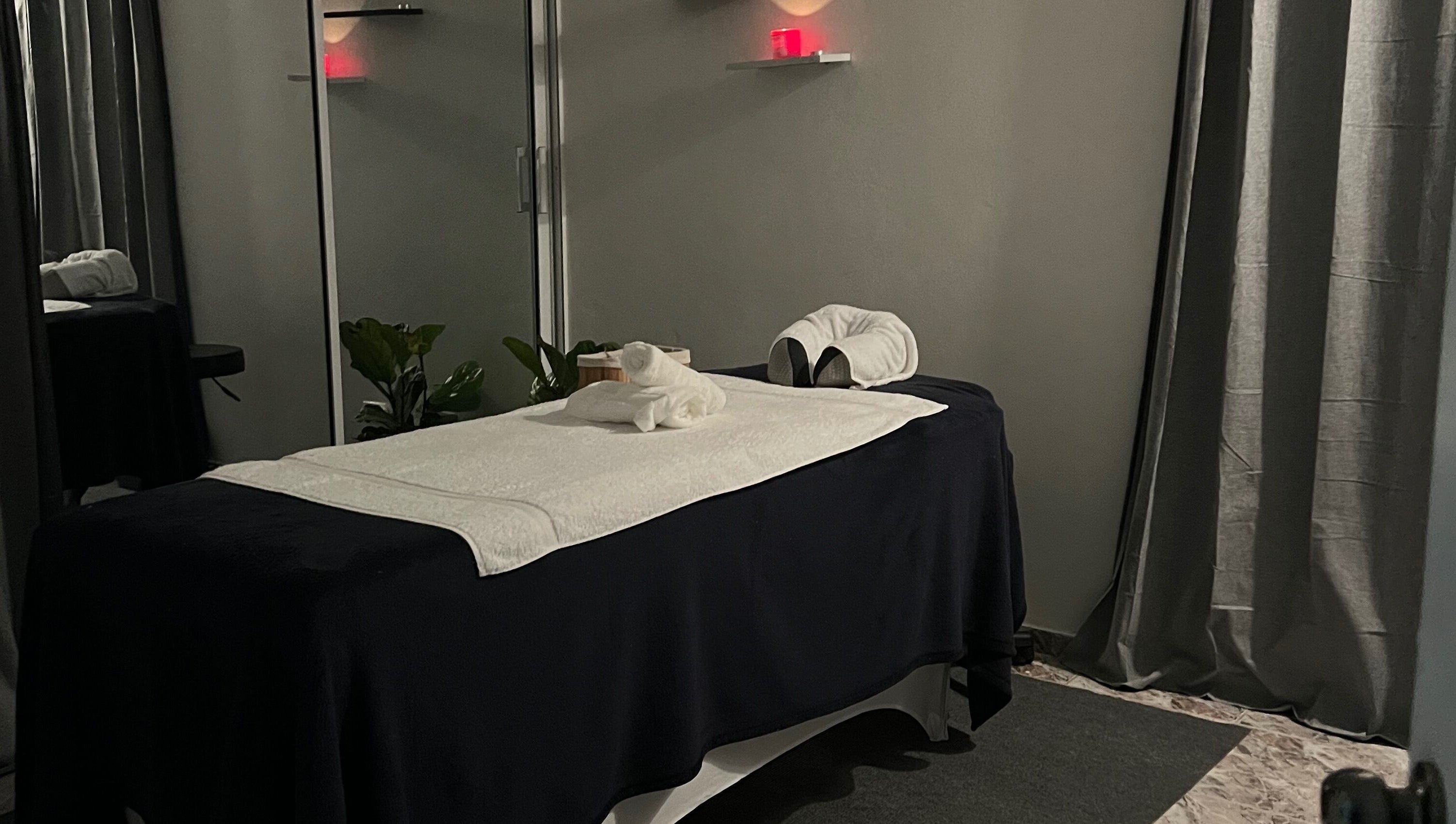 Tranquil massage room at Caya Spa, Santiago De Los Caballeros, Santiago, DO, featuring a cozy massage table.