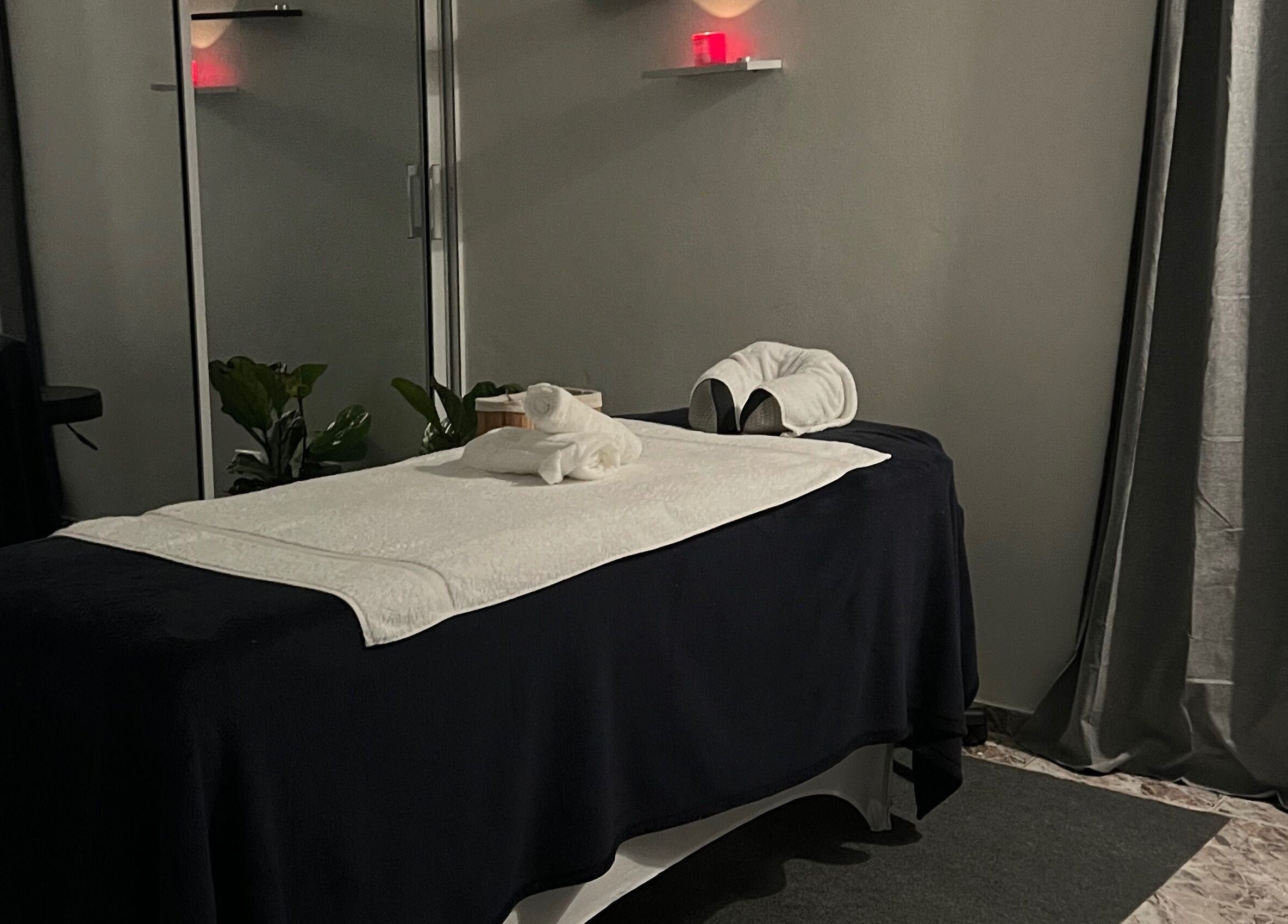 Tranquil massage room at Caya Spa, Santiago De Los Caballeros, Santiago, DO, featuring a cozy massage table.