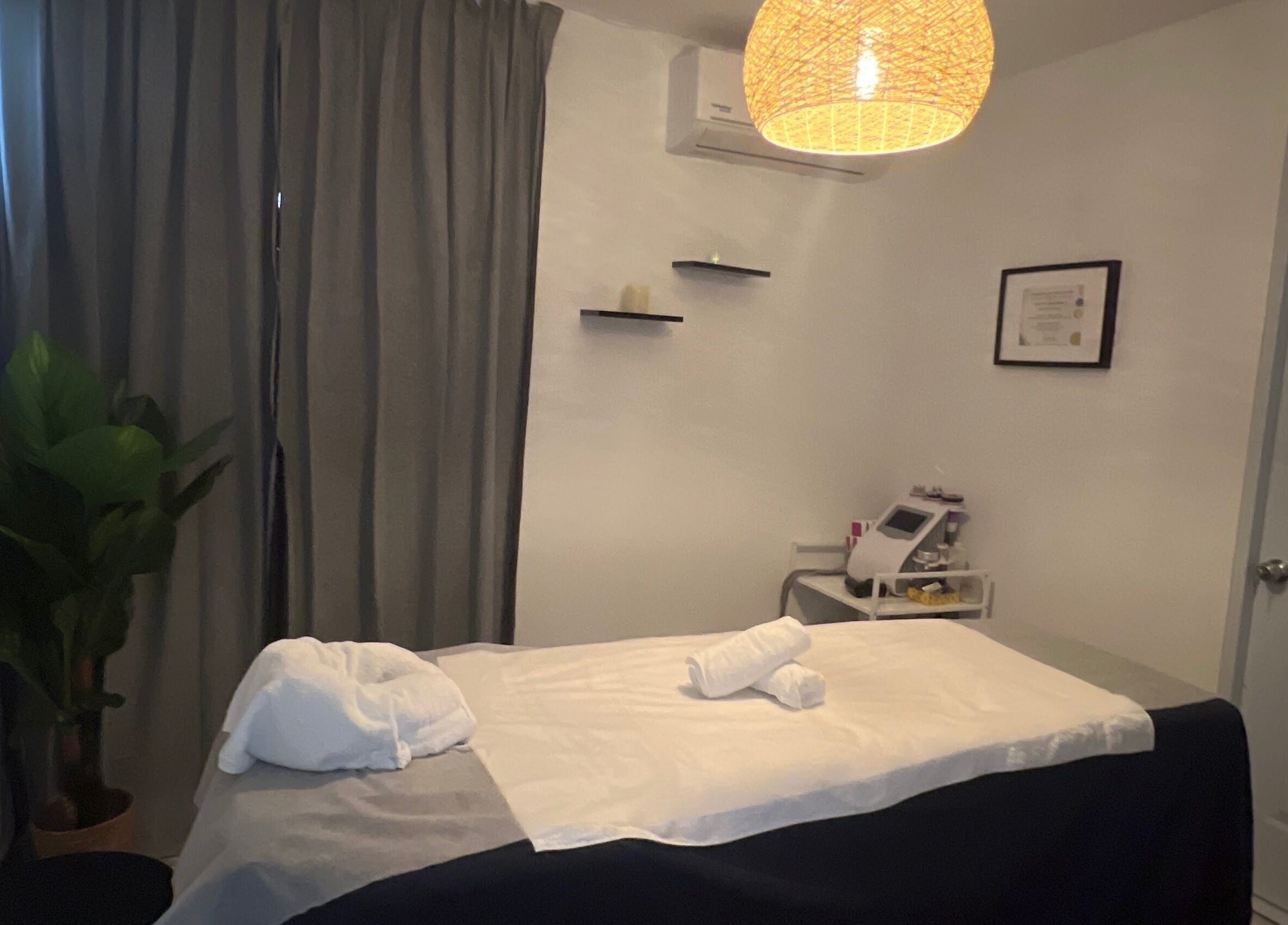 Tranquil treatment room at Caya Spa, Santiago De Los Caballeros, Santiago, DO, featuring a massage table.