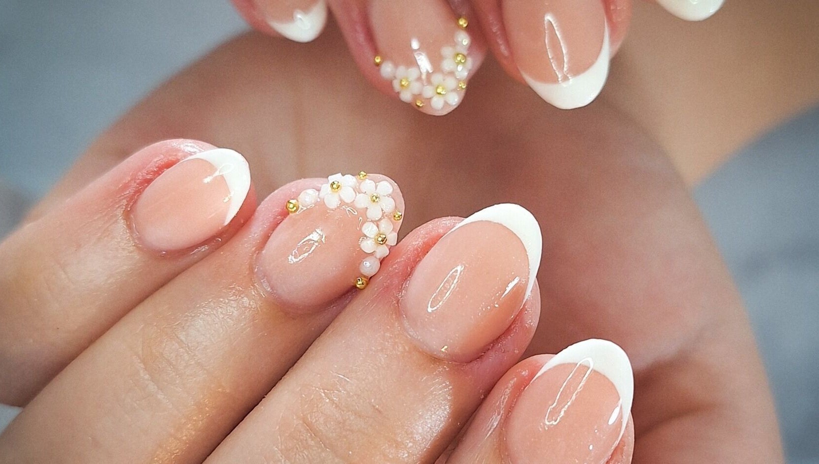 French manicure with floral accents at WanderLush Beauty Studio, Ballito, Kwazulu-natal, ZA.