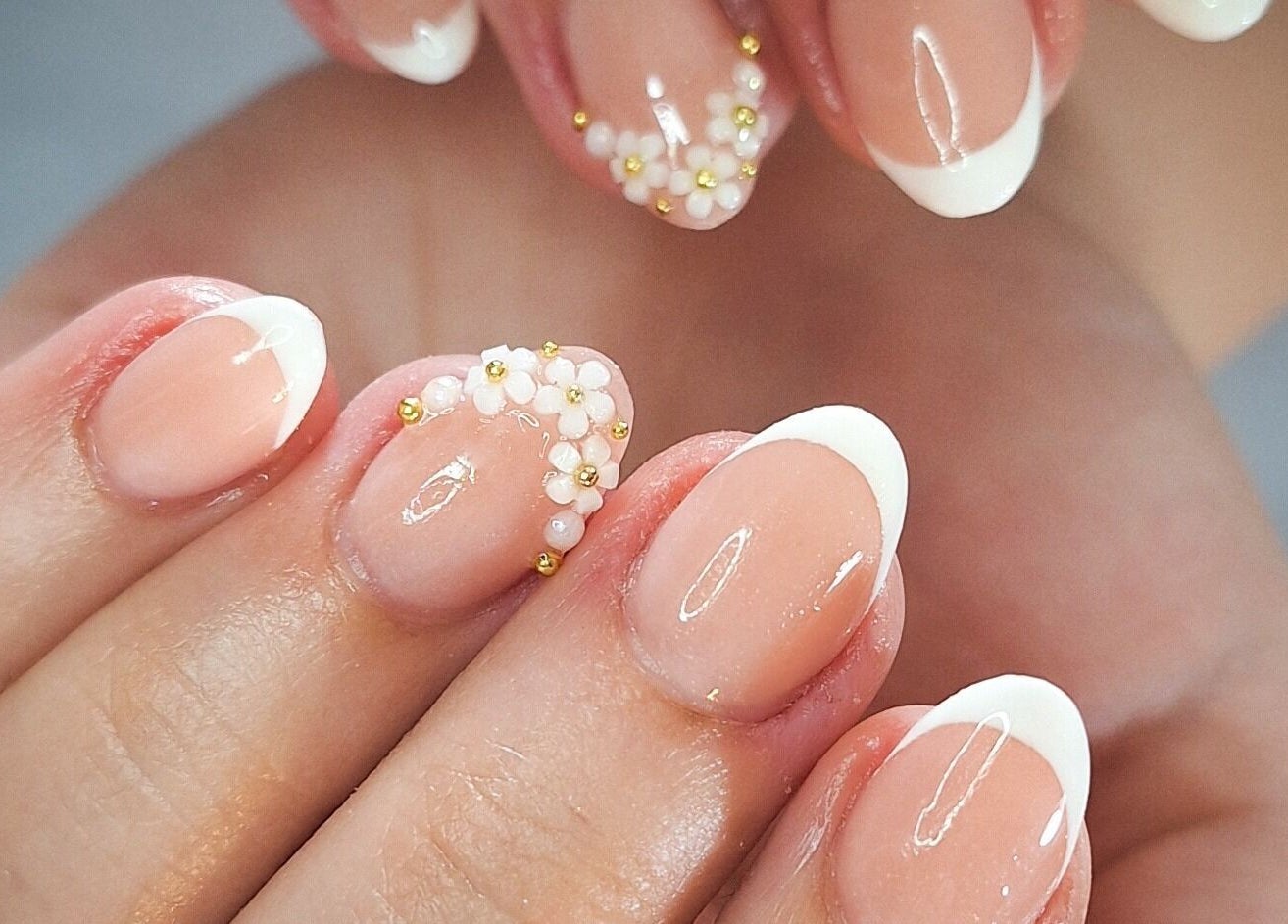 French manicure with floral accents at WanderLush Beauty Studio, Ballito, Kwazulu-natal, ZA.