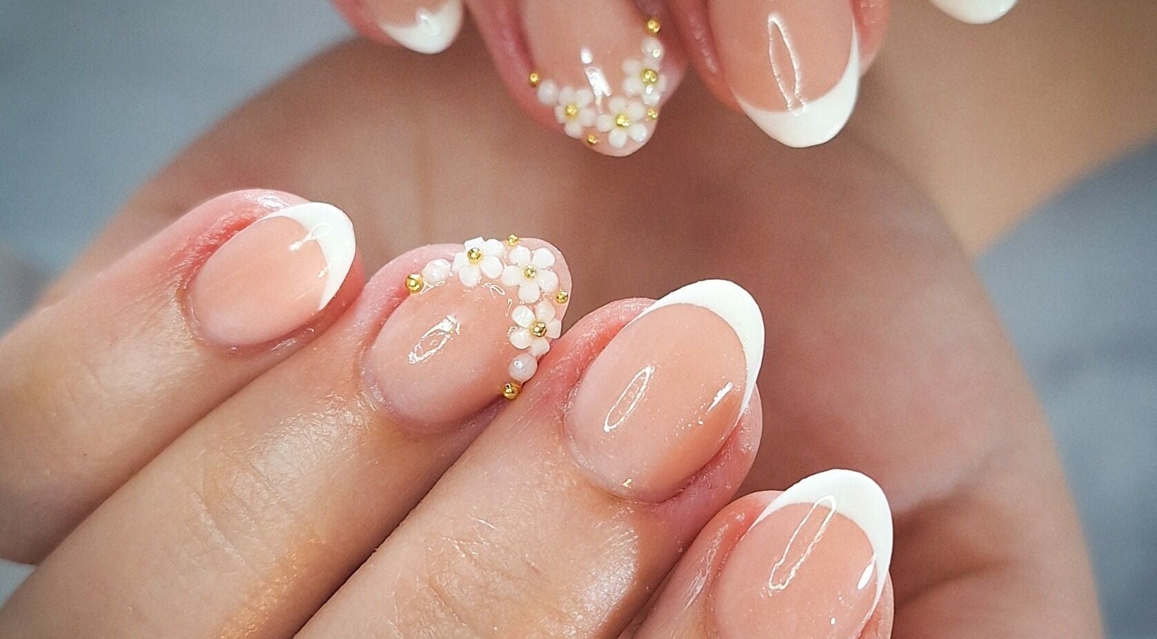 French manicure with floral accents at WanderLush Beauty Studio, Ballito, Kwazulu-natal, ZA.