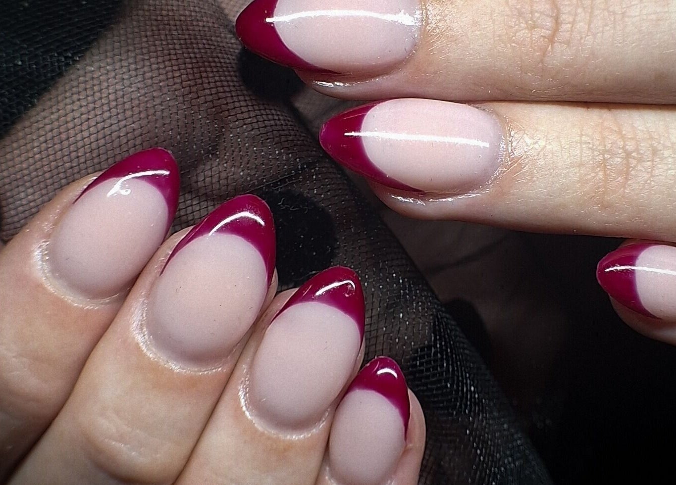 Elegant red-tipped nails at WanderLush Beauty Studio, Ballito, Kwazulu-natal, ZA, showcasing expert nail art.