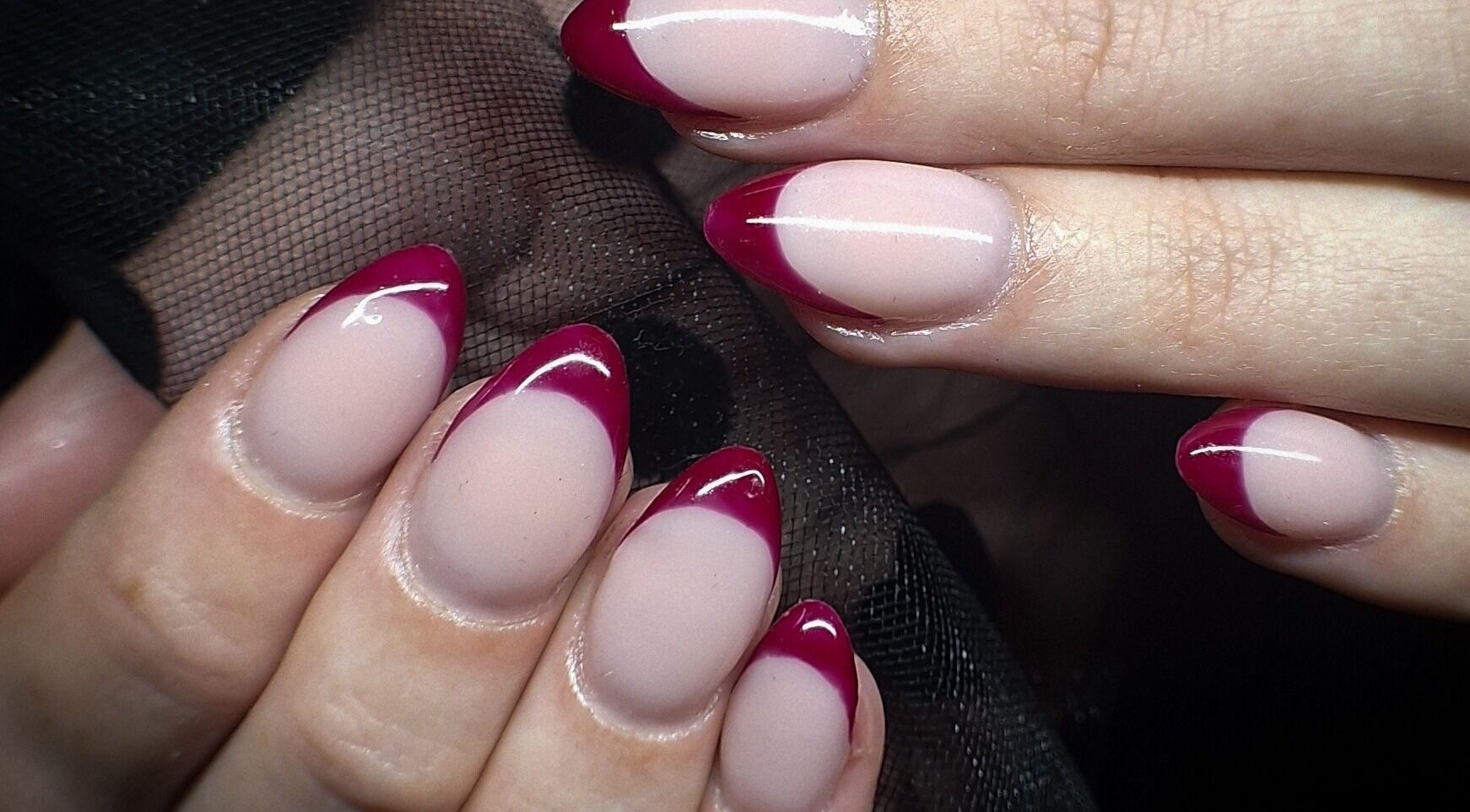 Elegant red-tipped nails at WanderLush Beauty Studio, Ballito, Kwazulu-natal, ZA, showcasing expert nail art.