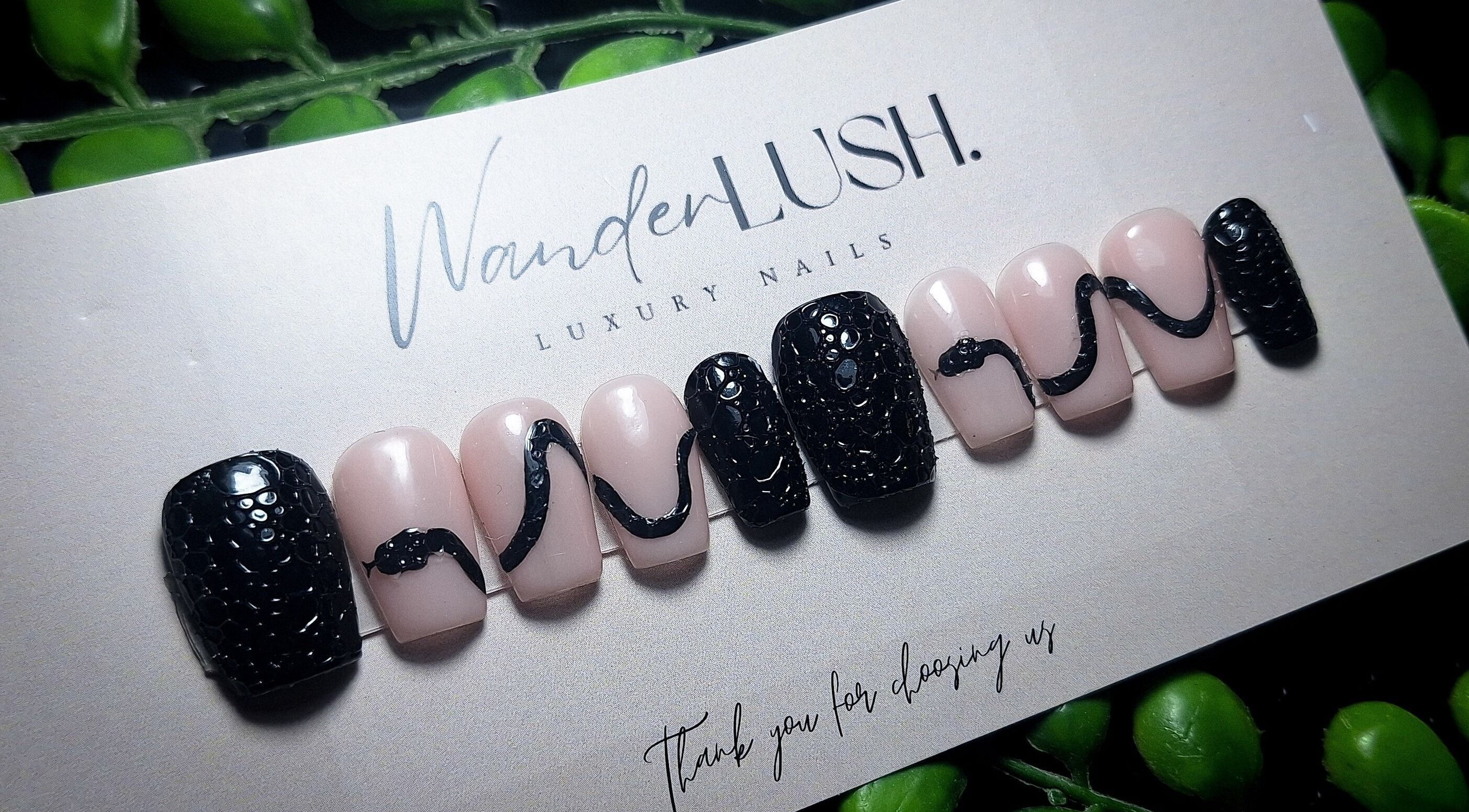 Stylish nail design by WanderLush Beauty Studio in Ballito, Kwazulu-natal, ZA with intricate black patterns.