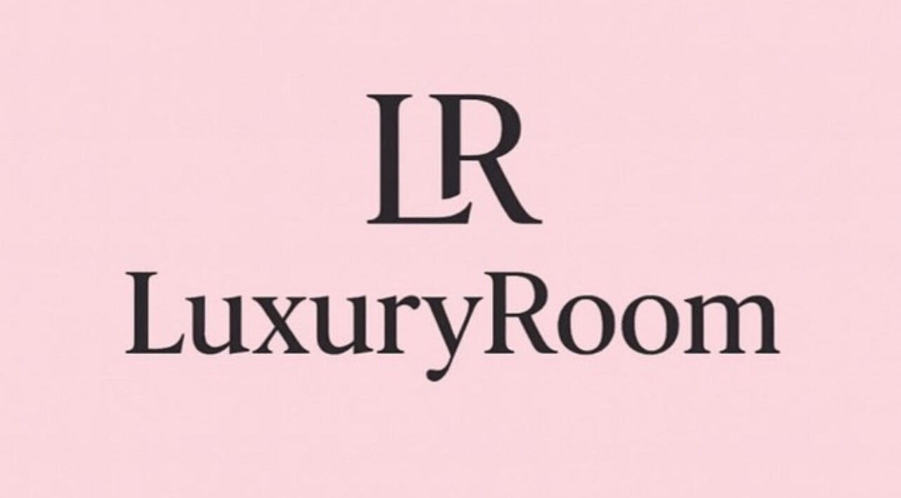 LuxuryRoom's refined logo on a pink background in Kettering, England, GB.