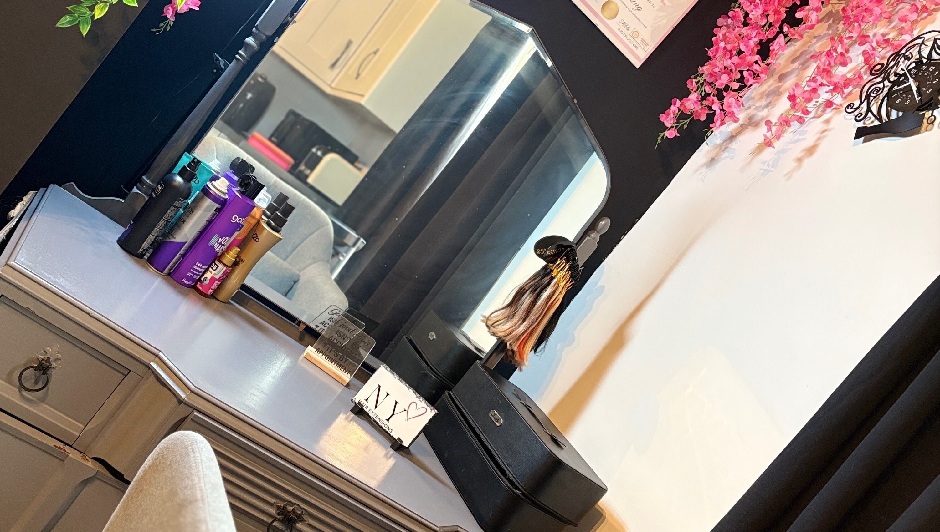 Elegant vanity setup at NYHairextensions, Carlisle, England, GB with beauty products and decor.