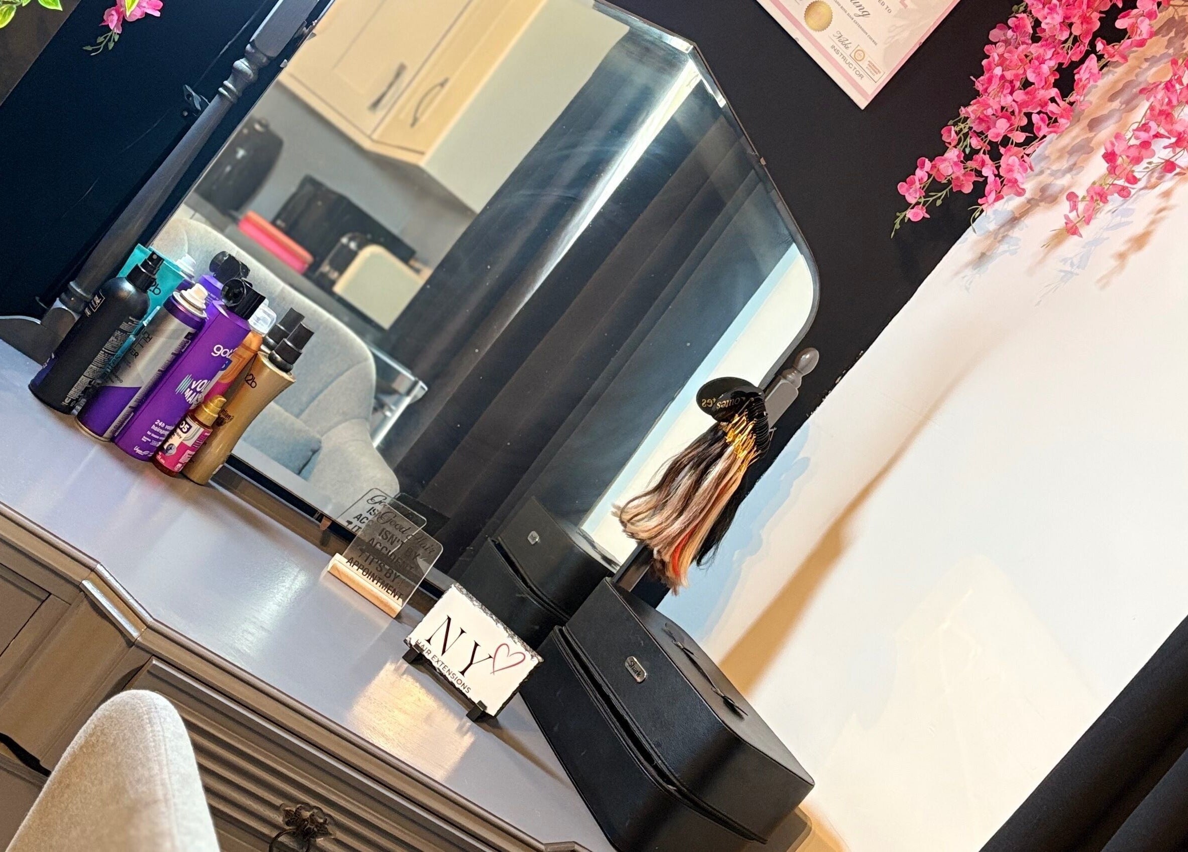 Elegant vanity setup at NYHairextensions, Carlisle, England, GB with beauty products and decor.