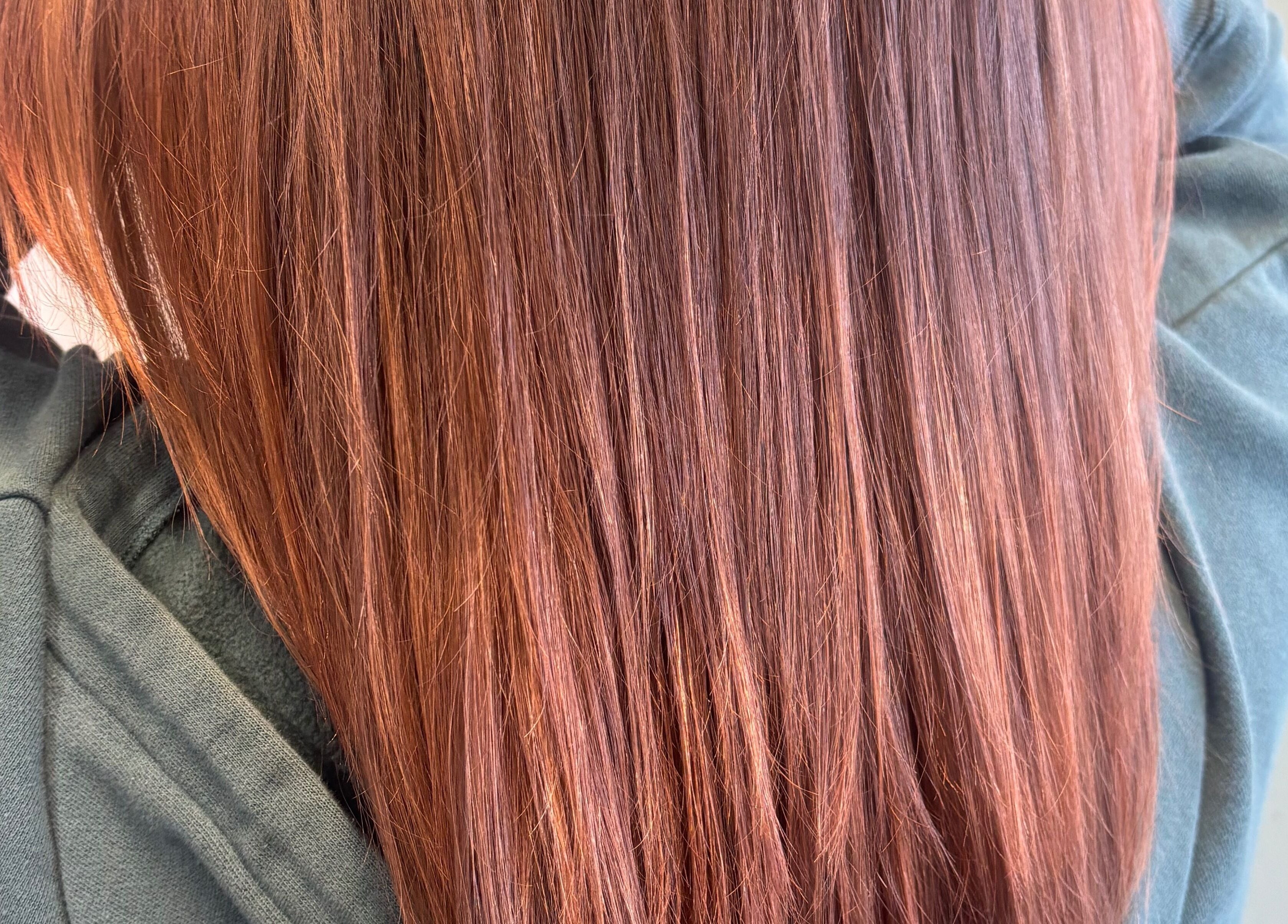 Smooth auburn hair styled at Hair Love by Taryn in Lakeland, Florida, US.