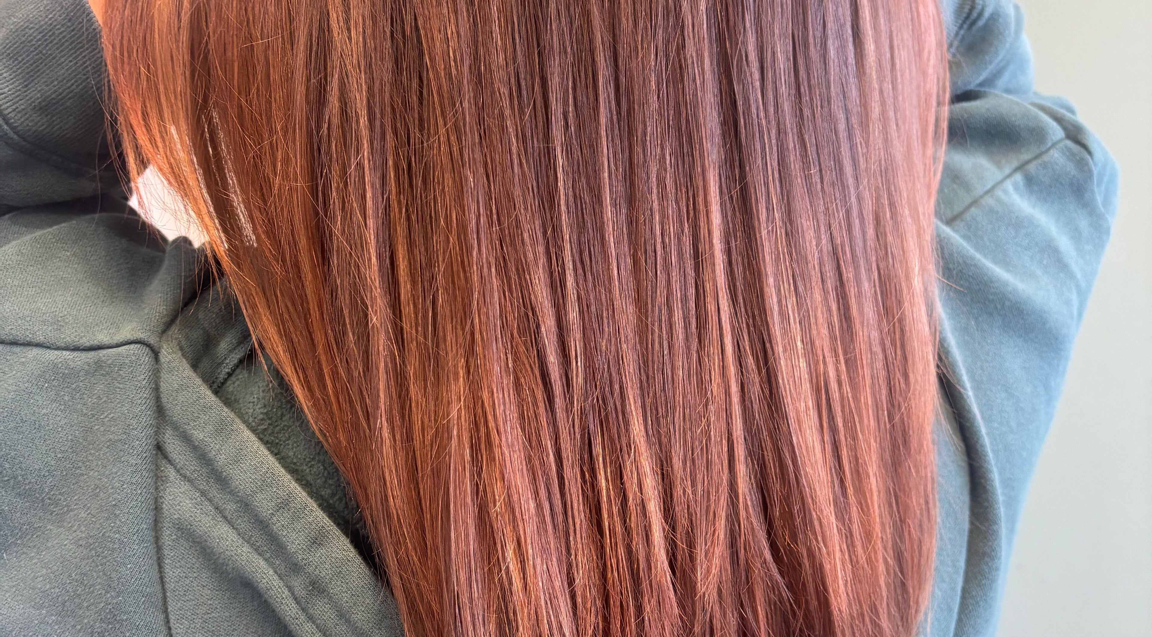 Smooth auburn hair styled at Hair Love by Taryn in Lakeland, Florida, US.
