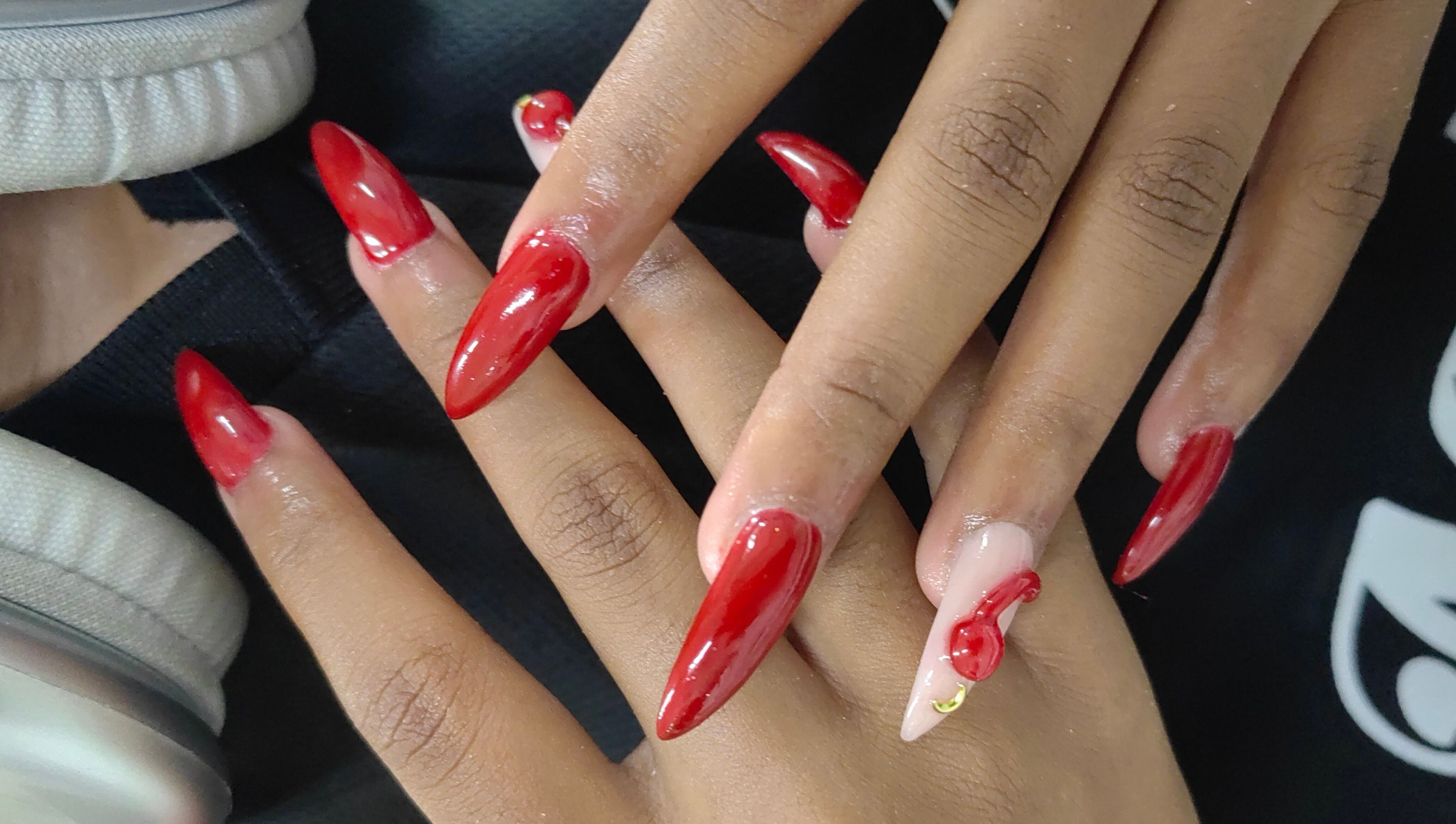 Stylish red manicure at The Beauty Booth in Bloemfontein, Free State, ZA. Elegantly shaped nails with glossy finish.