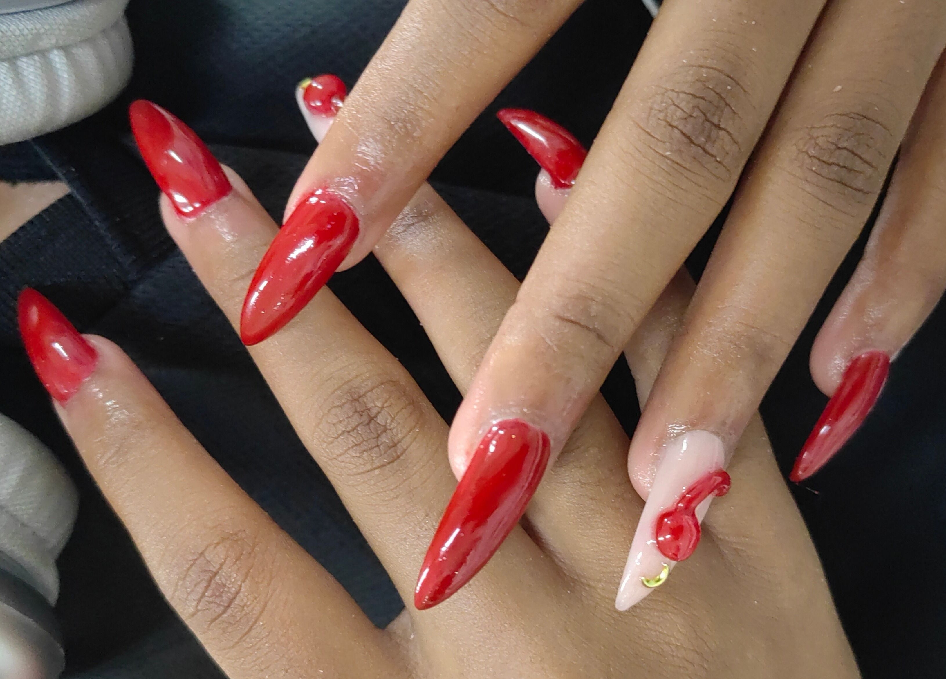 Stylish red manicure at The Beauty Booth in Bloemfontein, Free State, ZA. Elegantly shaped nails with glossy finish.