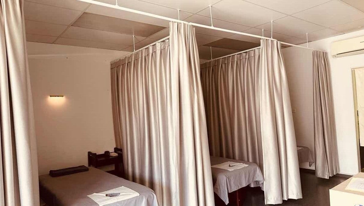 Tranquil massage rooms at Rosedale Traditional Massage in Auckland, Auckland, NZ with privacy curtains and treatment beds.
