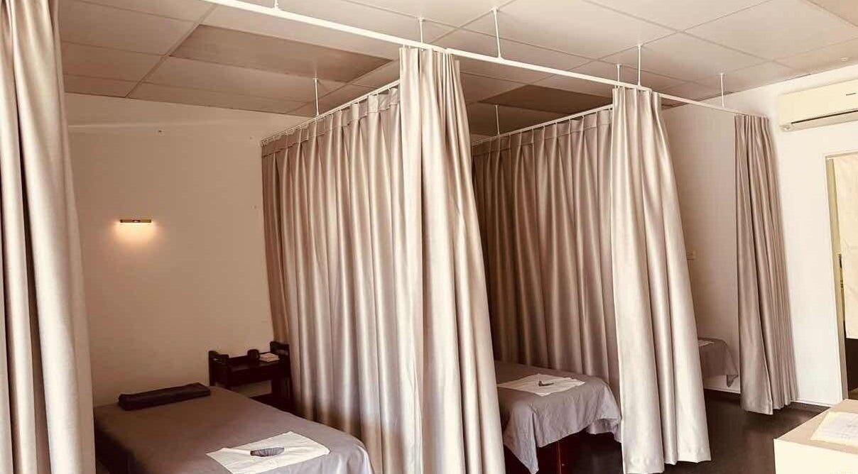 Tranquil massage rooms at Rosedale Traditional Massage in Auckland, Auckland, NZ with privacy curtains and treatment beds.