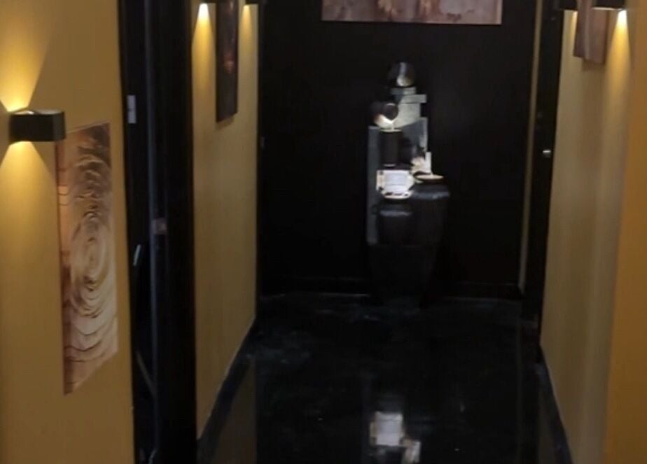Elegant hallway at Velour Men’s Spa, Atlanta, Georgia, US, with soothing lighting and modern decor.