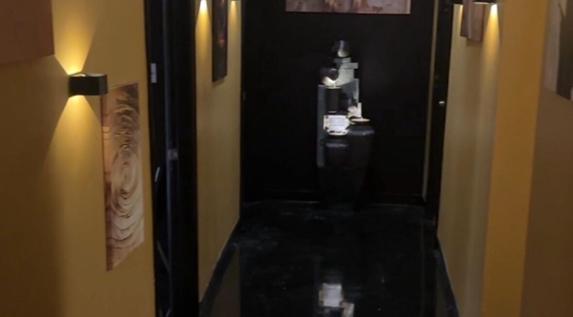 Elegant hallway at Velour Men’s Spa, Atlanta, Georgia, US, with soothing lighting and modern decor.