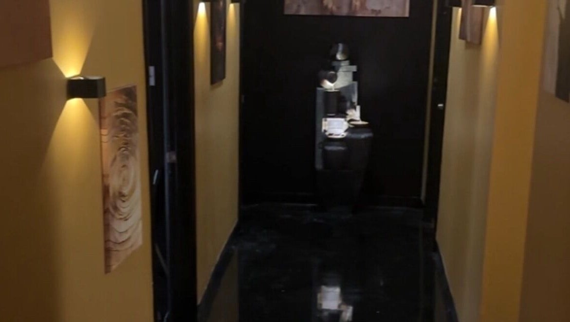 Elegant hallway at Velour Men’s Spa, Atlanta, Georgia, US, with warm lighting and modern decor.