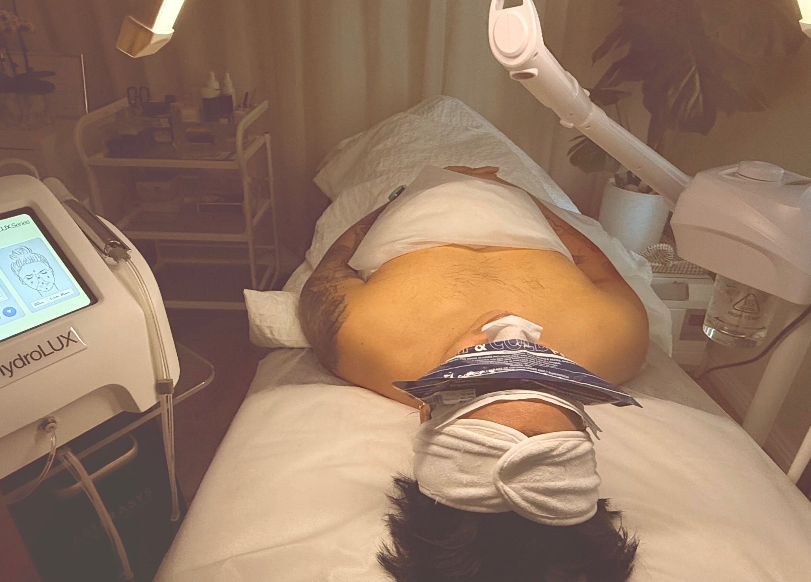 Client enjoying a facial treatment at M.N.M Beauty Bar in Roselands, New South Wales, AU.