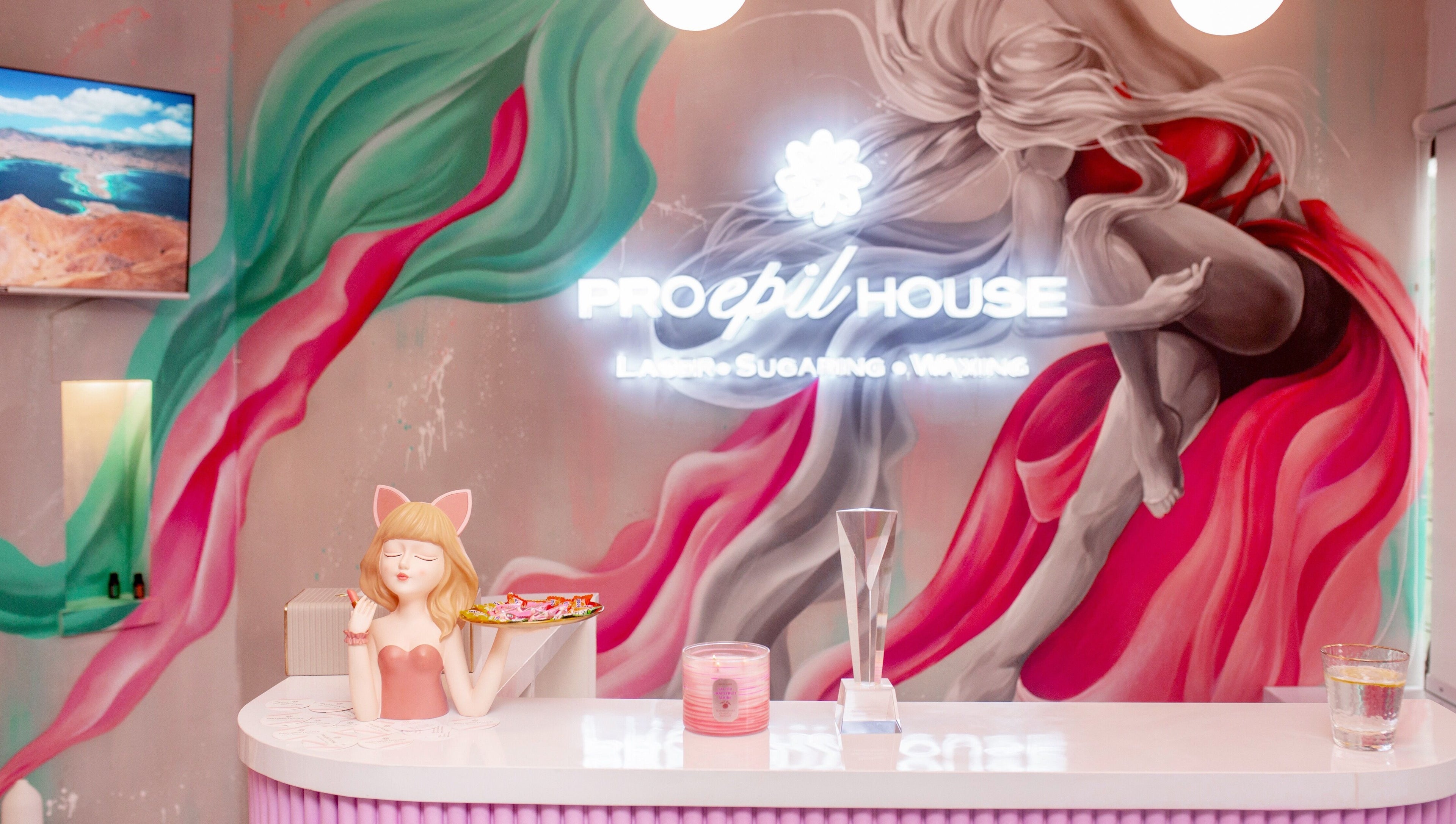 Colorful reception at Pro Epil House Ubud, Bali, Bali, ID with vibrant mural art and elegant decor.