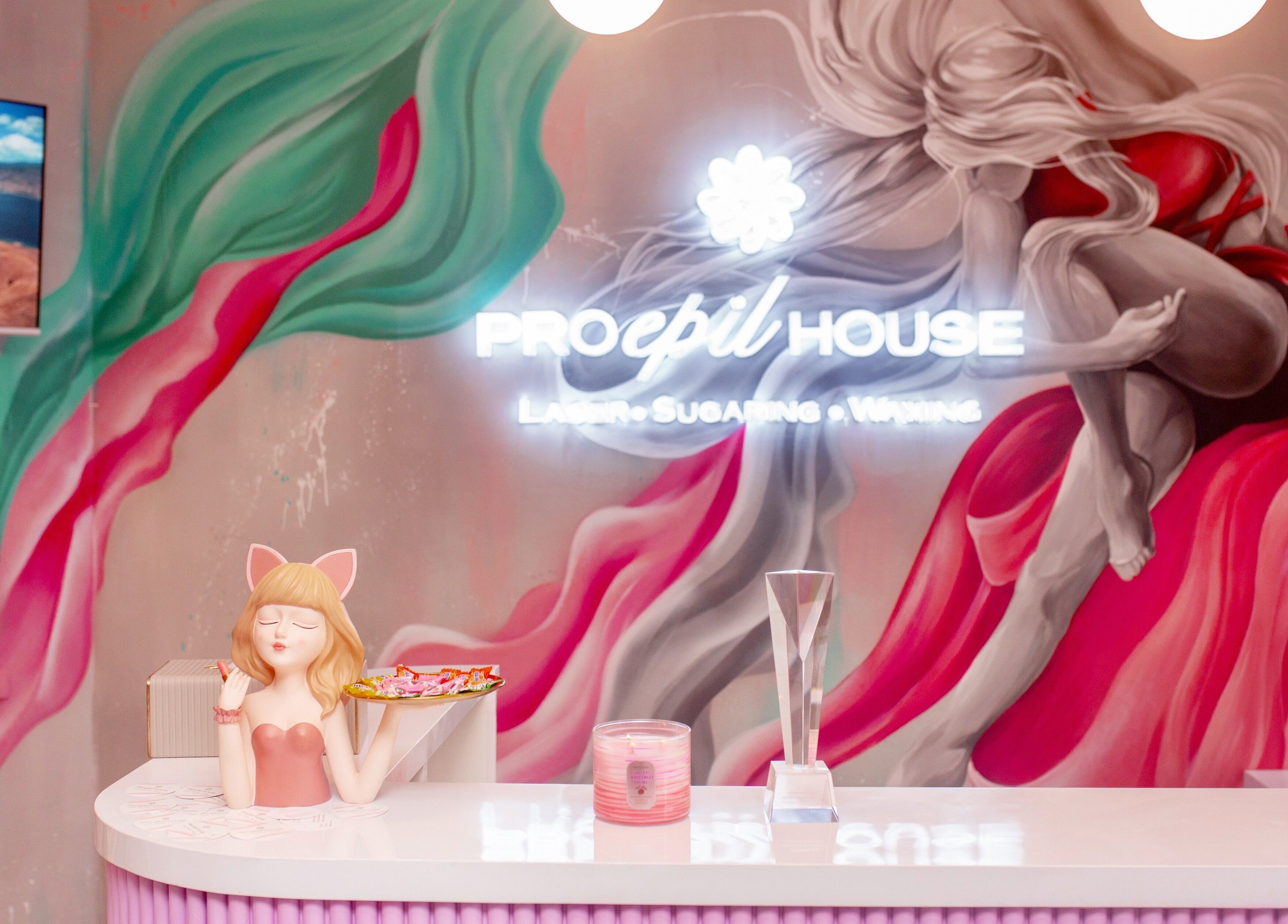 Colorful reception at Pro Epil House Ubud, Bali, Bali, ID with vibrant mural art and elegant decor.