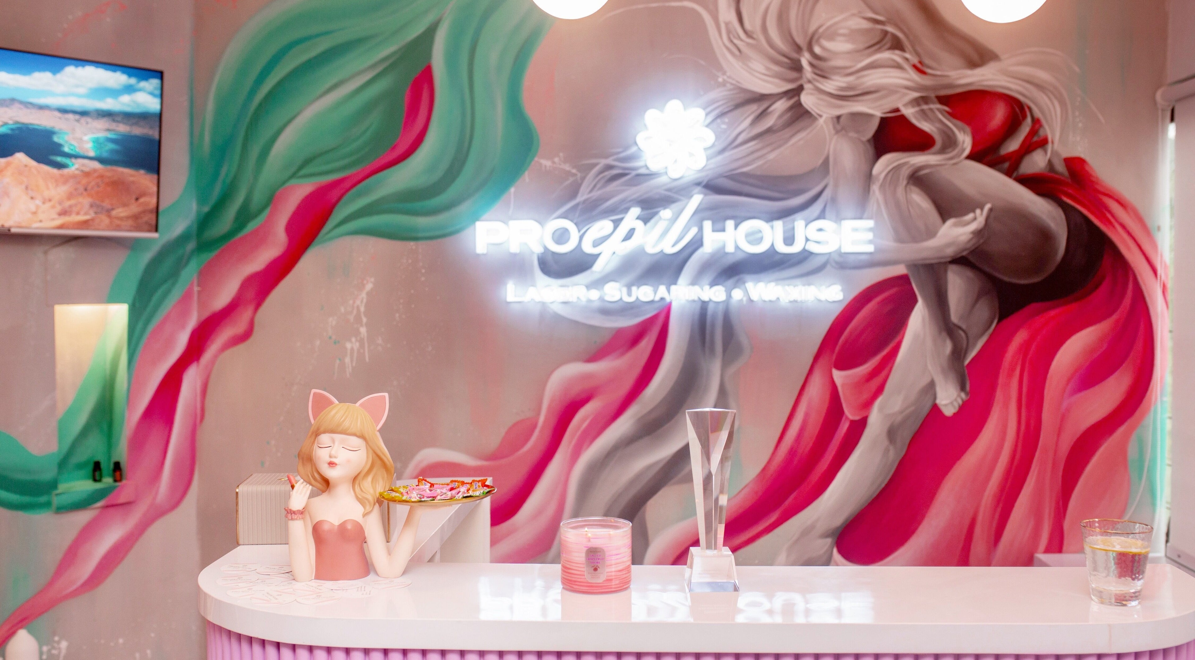 Colorful reception at Pro Epil House Ubud, Bali, Bali, ID with vibrant mural art and elegant decor.