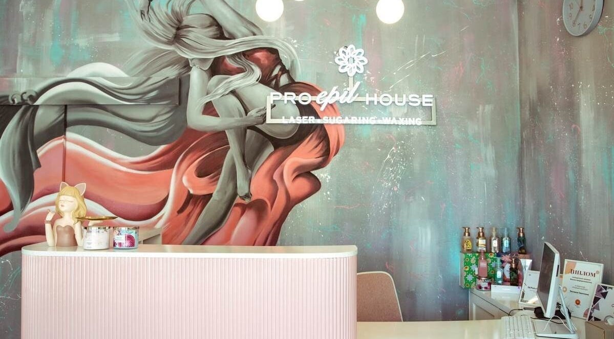 Reception area at Pro Epil House Kerobokan, Bali, Bali, ID, featuring a vibrant mural and modern decor.