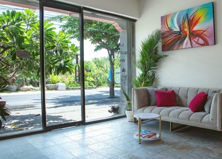 Relaxing seating in Pro Epil House Kerobokan with vibrant art in Bali, Bali, ID.