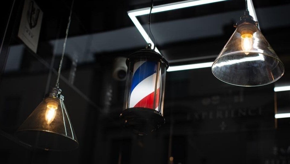 Stylish lighting and barber pole at Bar Bar Co, Brentwood offers a welcoming vibe in Brentwood, England, GB.